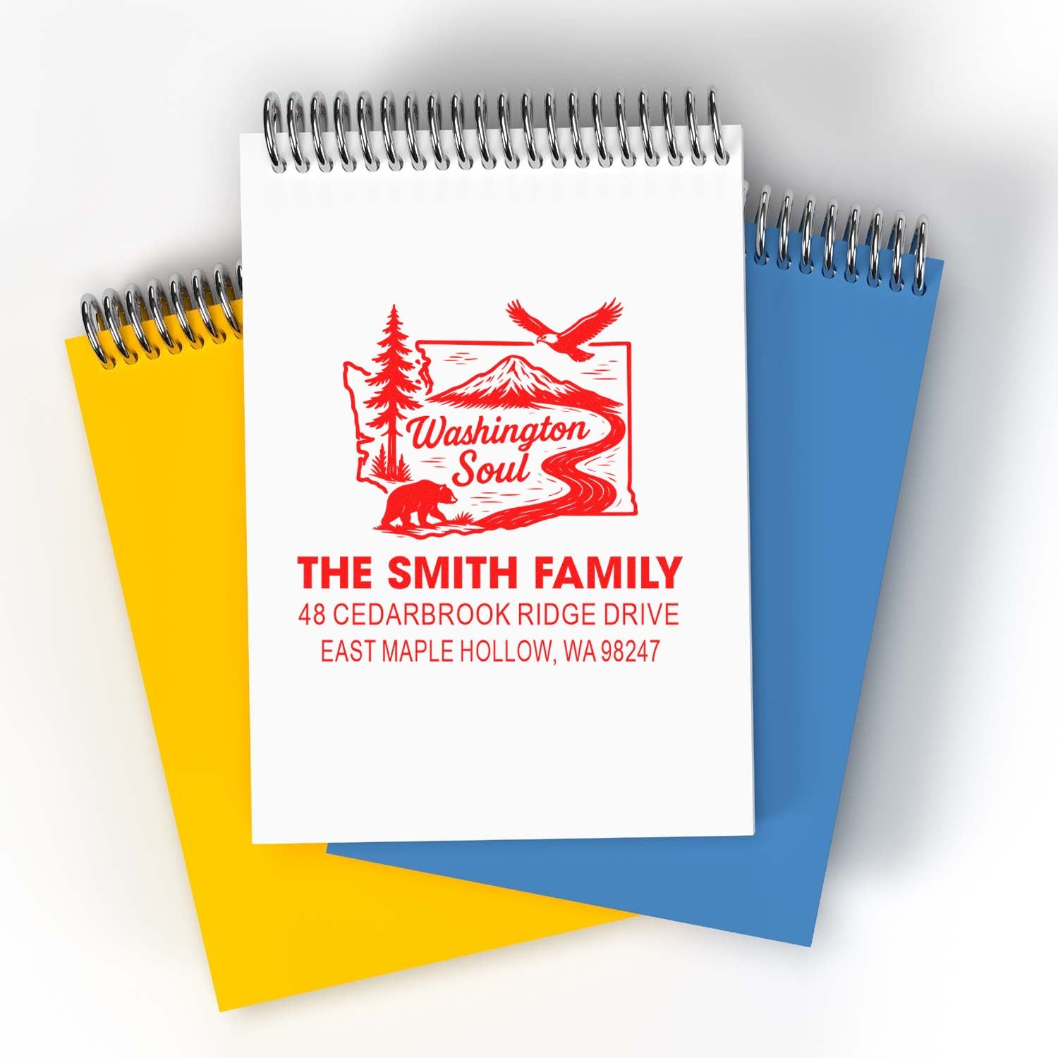 Custom Washington address stamp on spiral notebooks, featuring Washington Soul design, The Smith Family name, and East Maple Hollow, WA address.