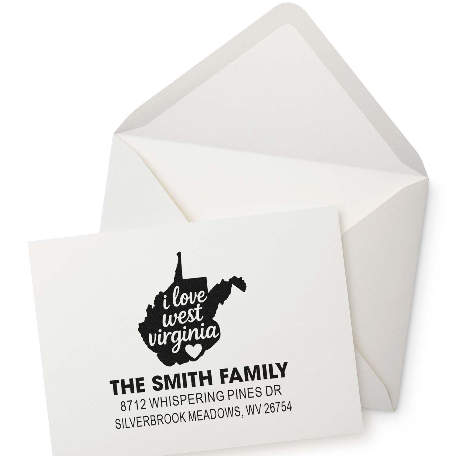 Personalized return address stamp with West Virginia heart design and Smith family address, shown on a white envelope and card.