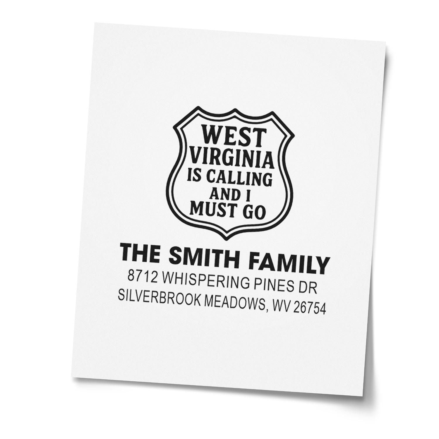 Custom return address stamp with West Virginia shield design and Smith Family address on white paper, featuring West Virginia is calling and I must go.
