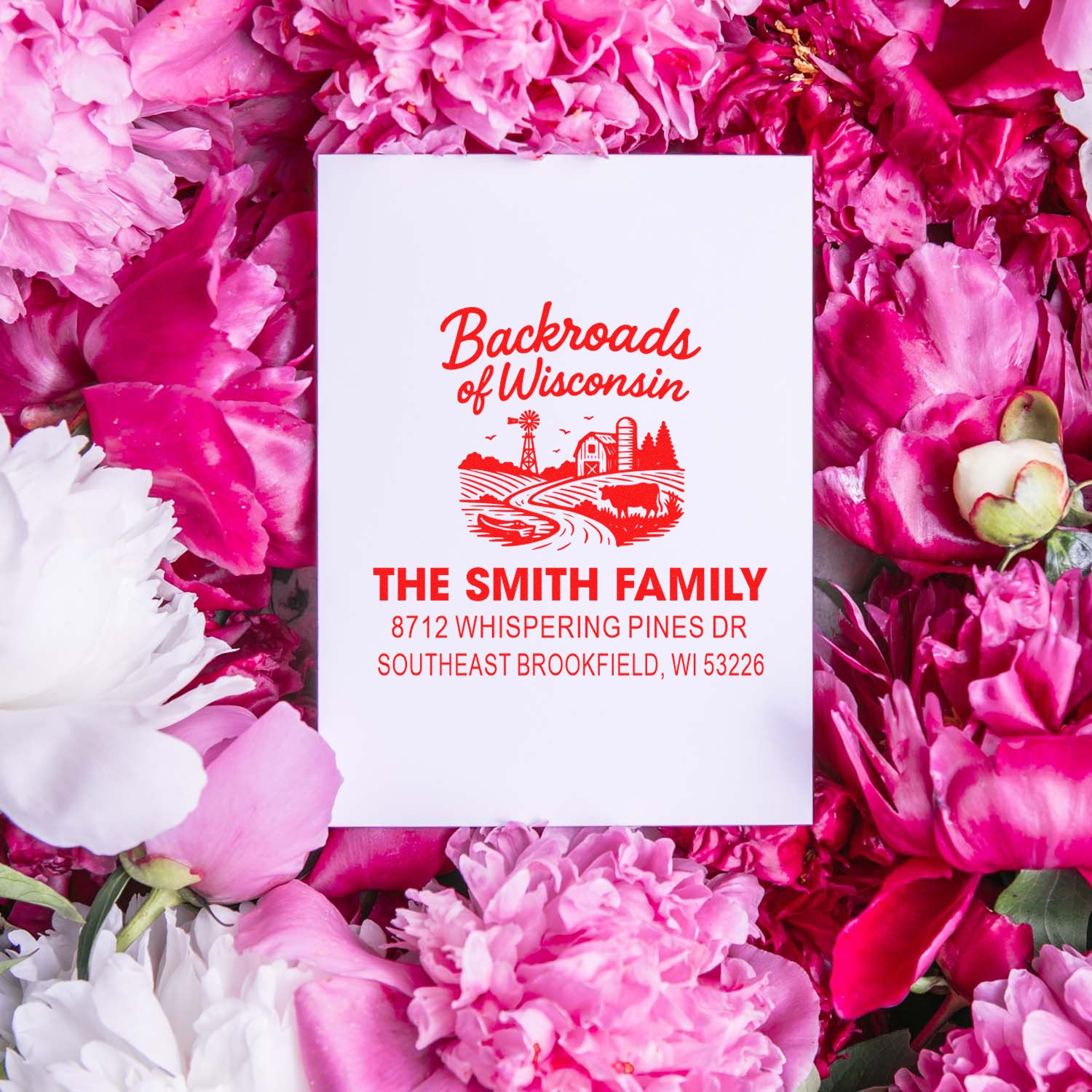 Custom address stamp with Backroads of Wisconsin design, displayed among pink peonies, featuring The Smith Family and Brookfield, WI address.