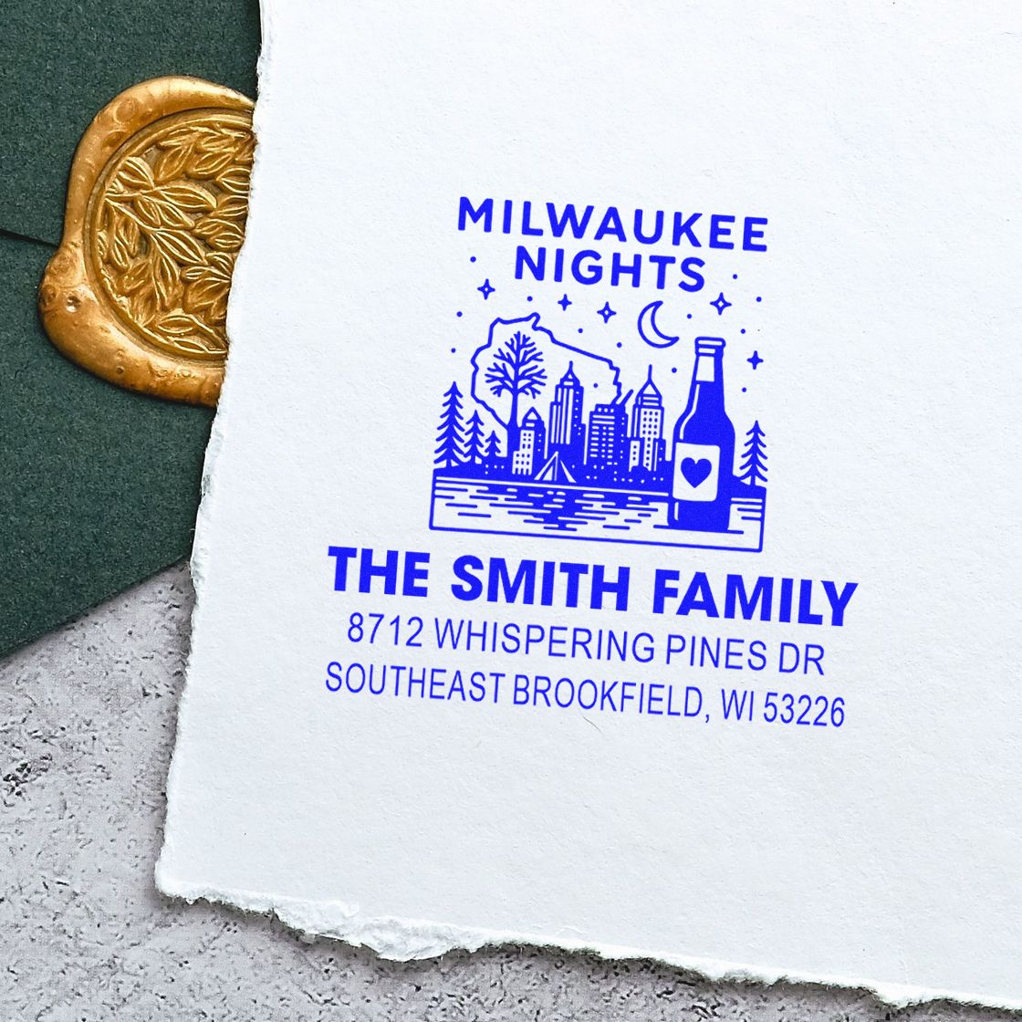 Custom blue rubber stamp for The Smith Family, Milwaukee Nights design, with skyline, bottle icon, and address on white paper.