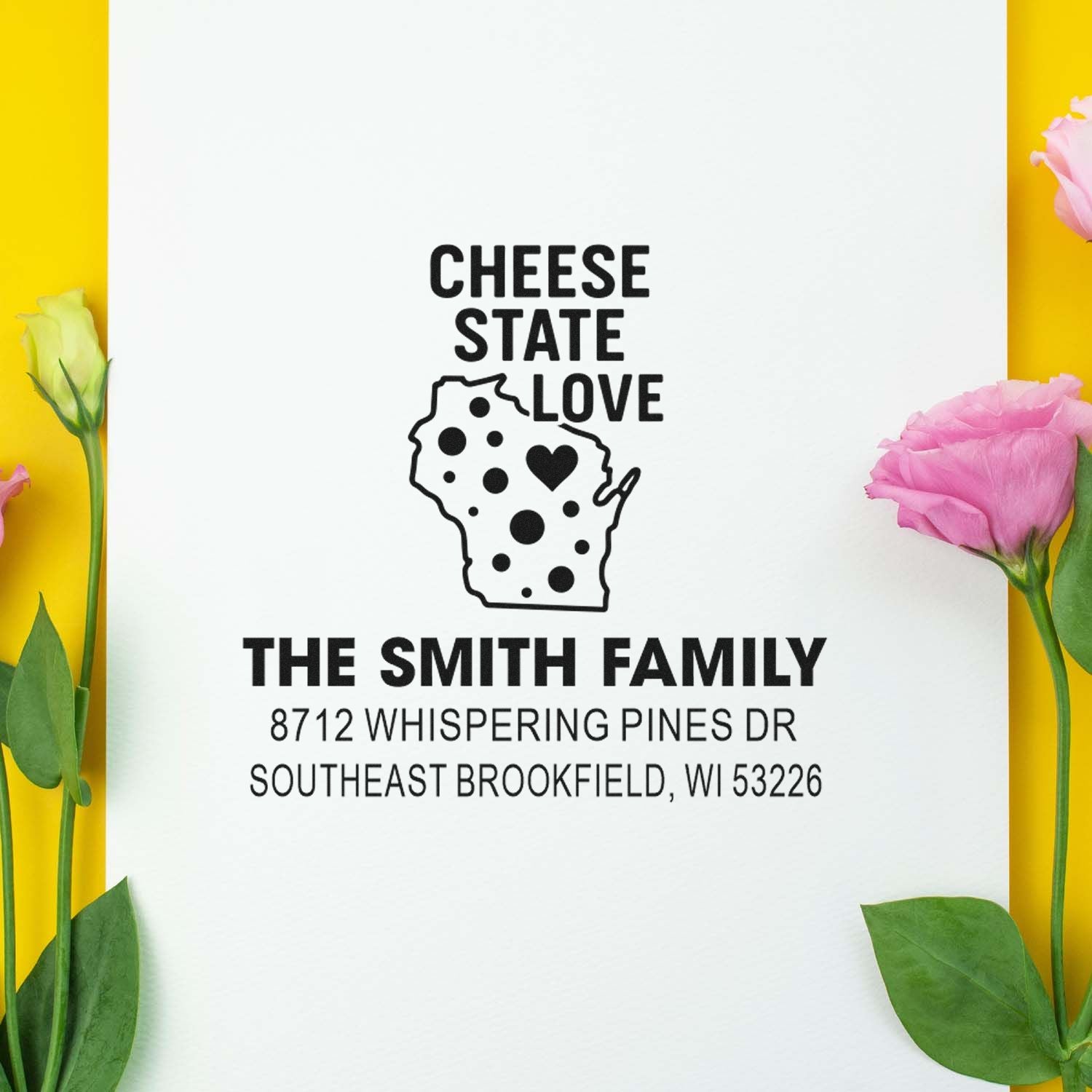 Personalized Wisconsin address stamp with Cheese State Love design, state outline and family name, styled on white paper with pink flowers.
