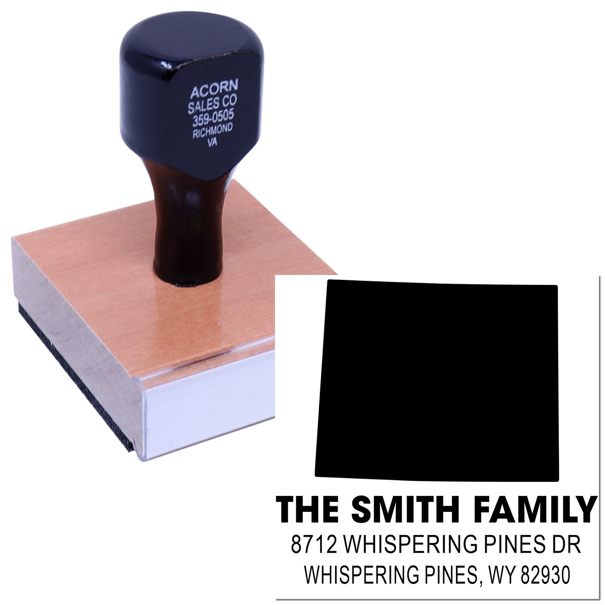Custom self-inking address stamp with The Smith Family and Whispering Pines, WY address, shown on a white background with ink pad and stamp block.
