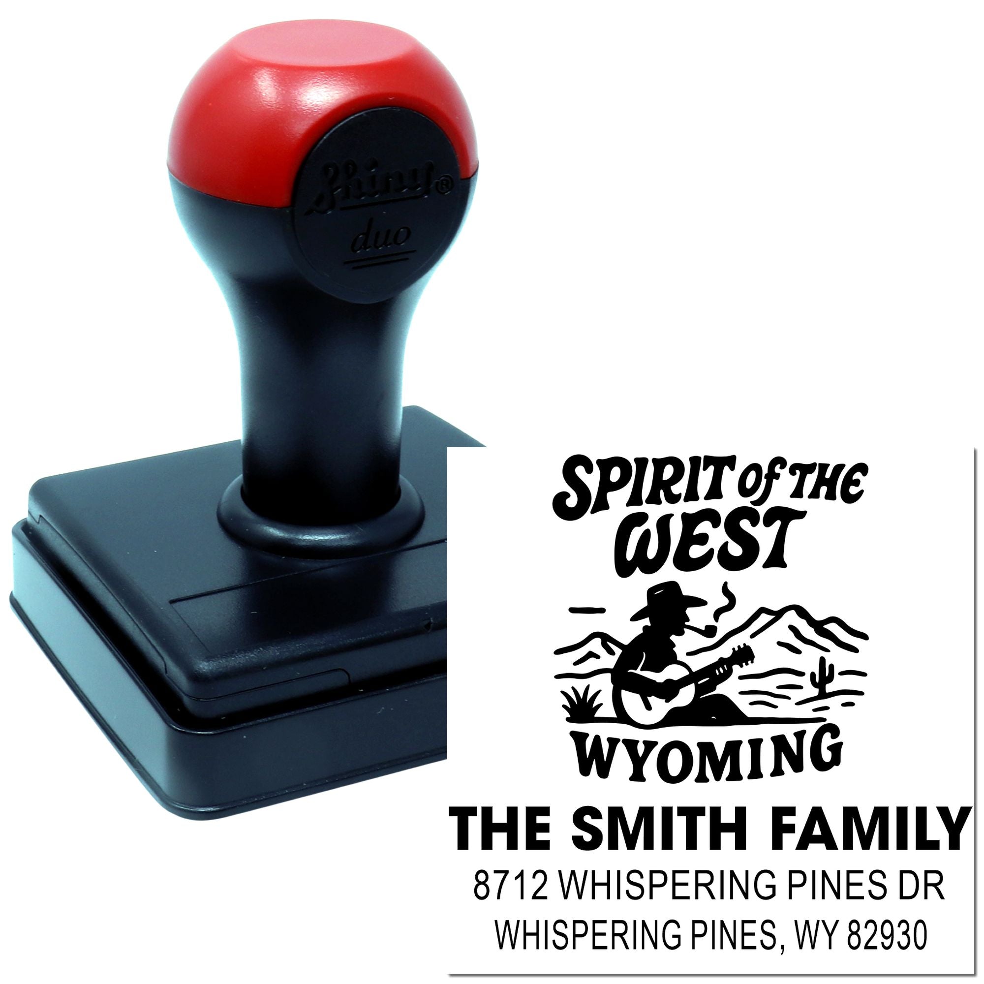 Self-inking address stamp with red handle, featuring Spirit of the West Wyoming design and Smith family return address on a white background.