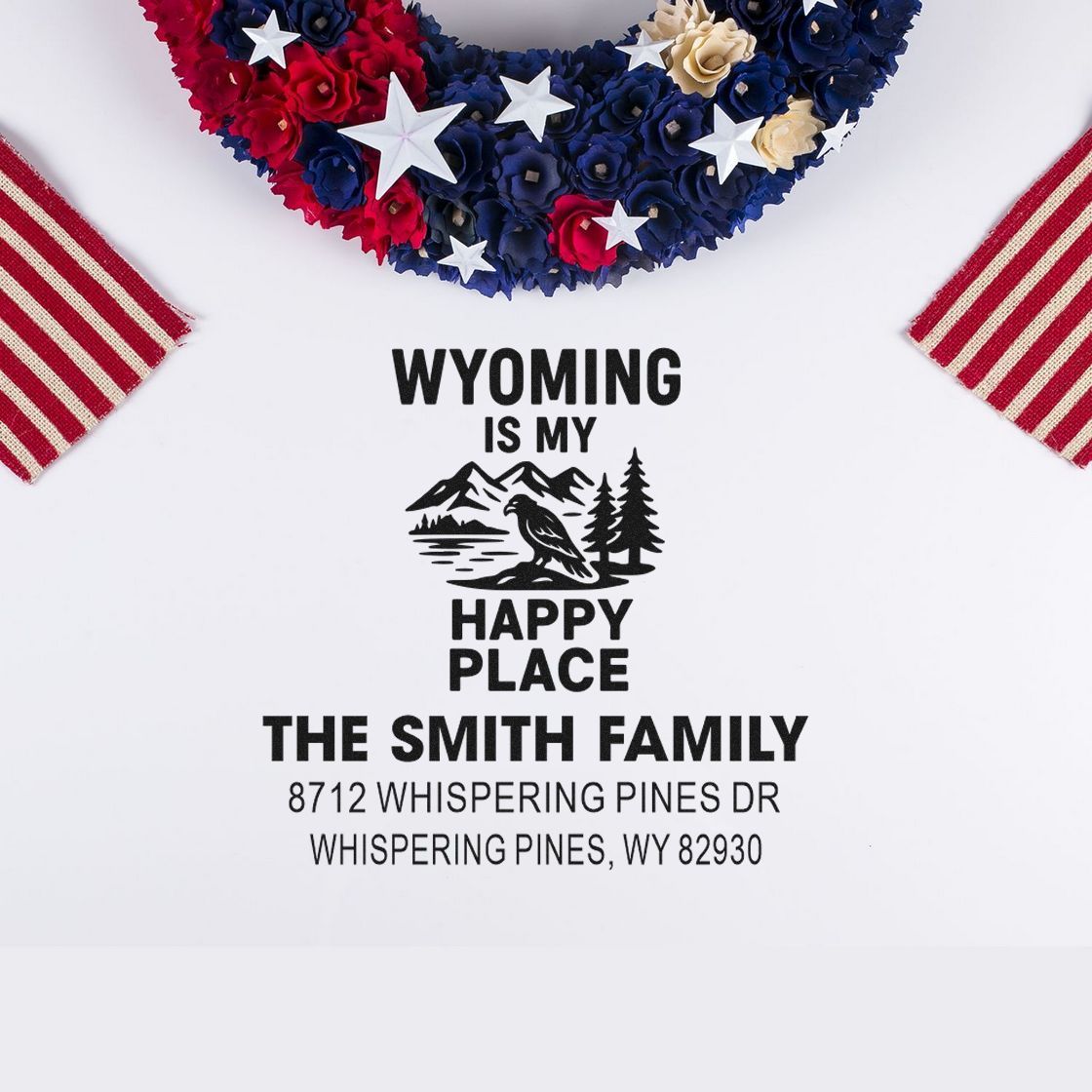 Custom Wyoming family address stamp with patriotic floral wreath and stars on white paper, reading Wyoming Is My Happy Place and The Smith Family.
