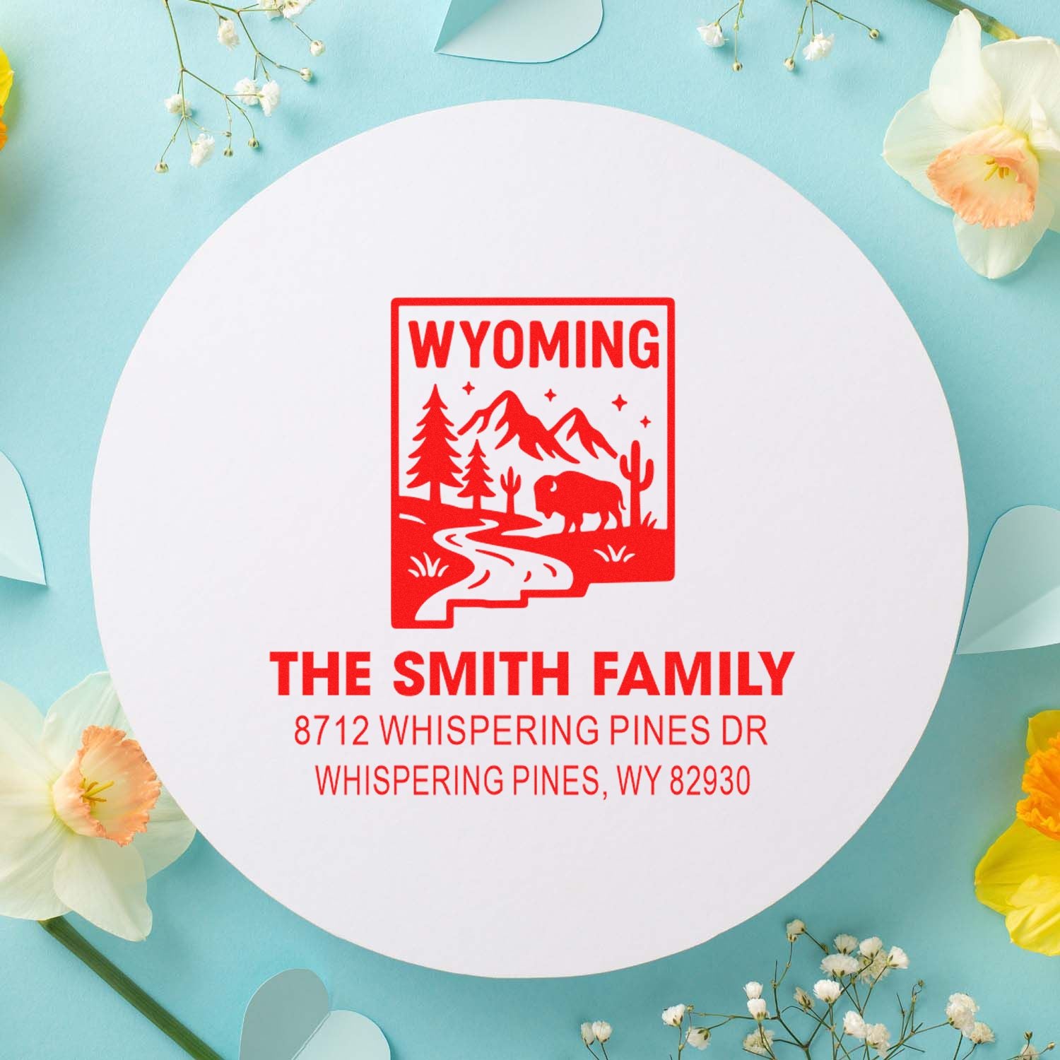 Custom Wyoming stamp with bison, mountains and pine trees, featuring The Smith Family address on a pastel floral display.