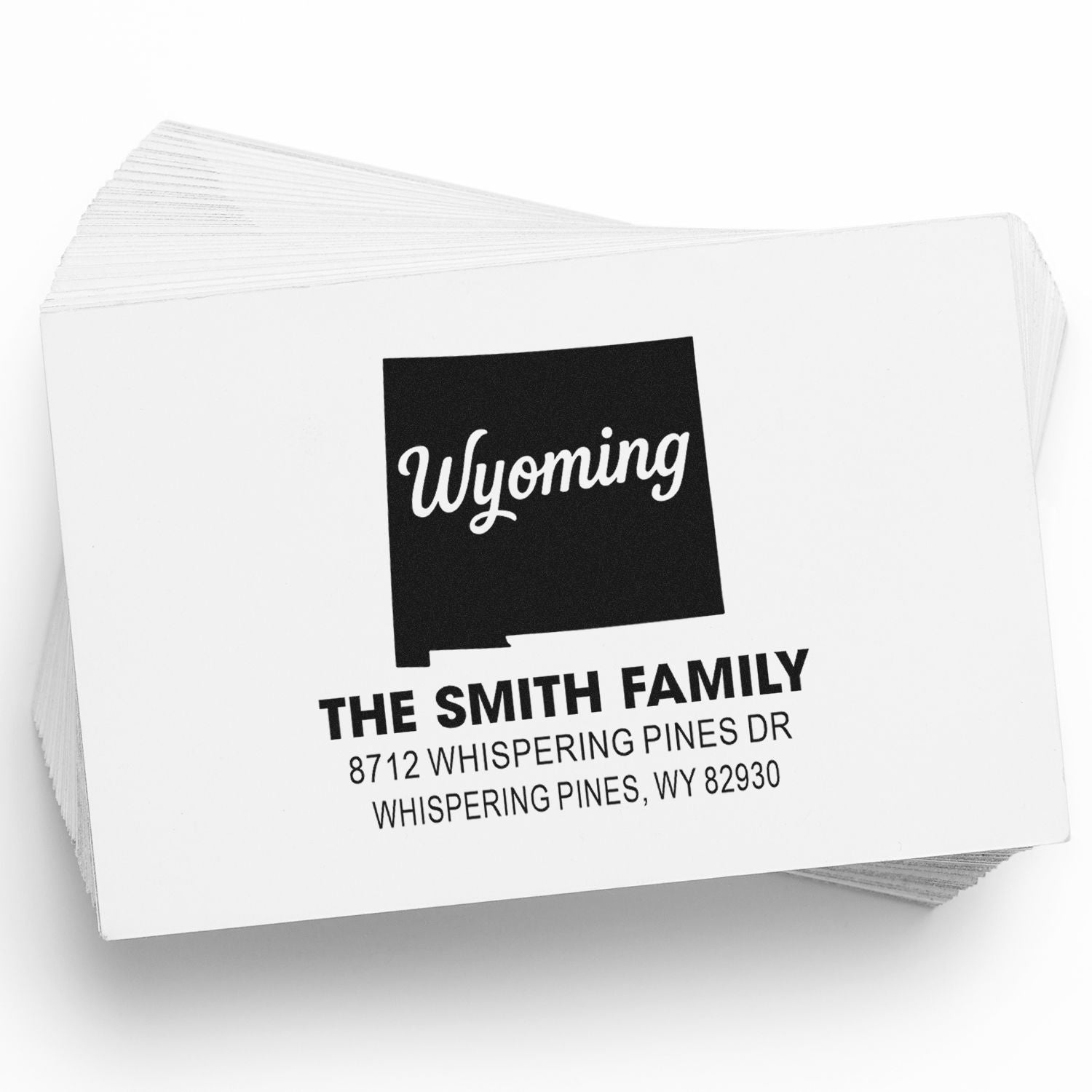 Personalized Wyoming family address stamps with black state design, featuring The Smith Family and Whispering Pines, WY mailing details.