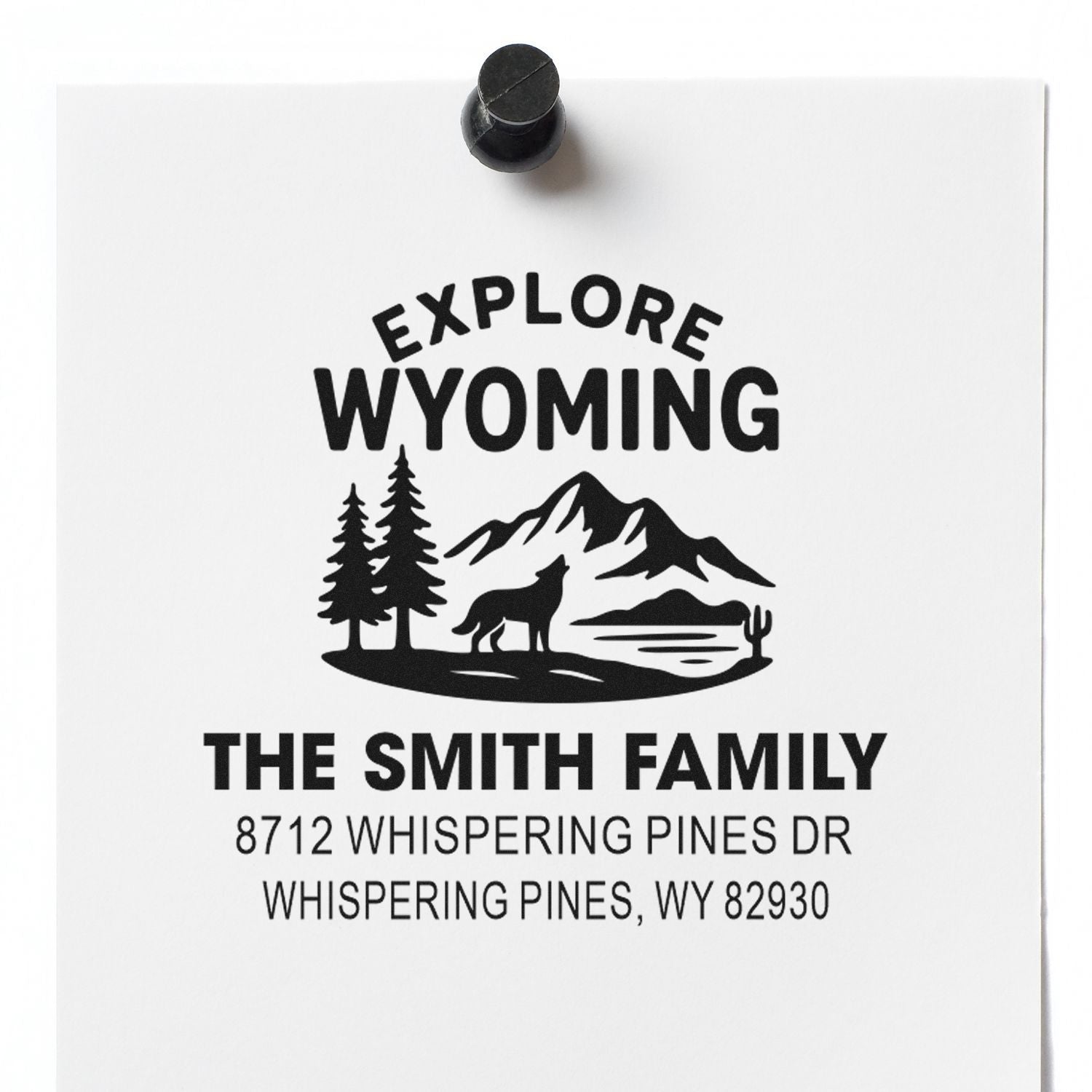 Personalized Explore Wyoming address stamp with mountains, pine trees, wolf and cactus, featuring The Smith Family and Whispering Pines address.