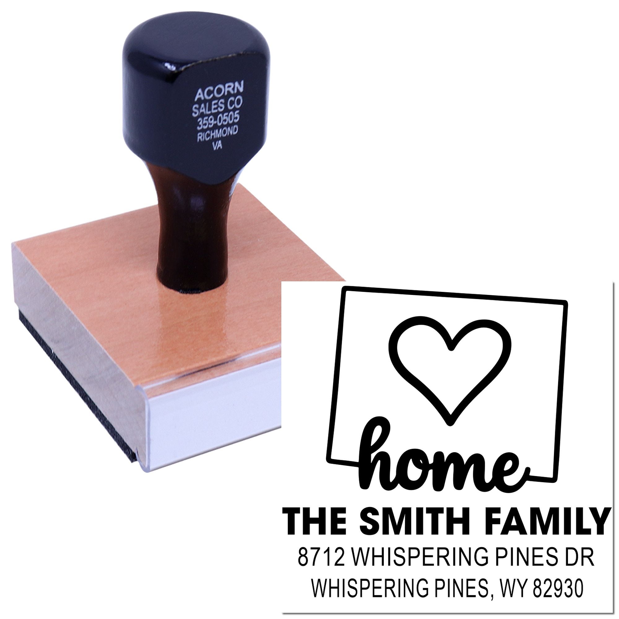 Custom self-inking rubber address stamp with heart and home design, showing The Smith Family and Whispering Pines, WY on a white background.