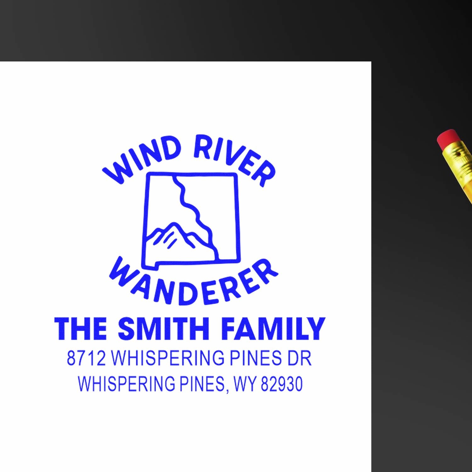 Custom address stamp for The Smith Family with Wind River Wanderer mountain logo and Whispering Pines, WY address on white.