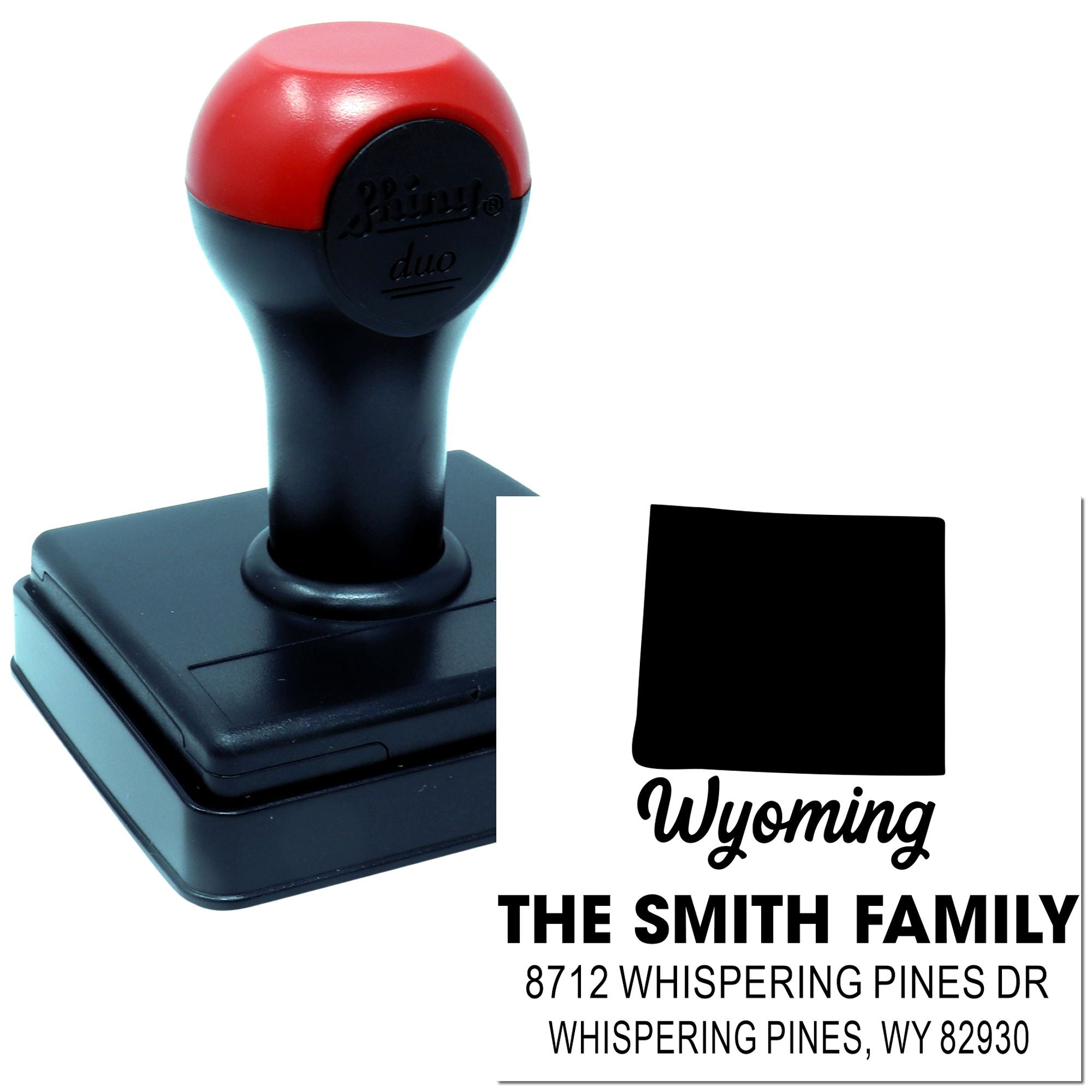 Custom self-inking address stamp for Wyoming, featuring The Smith Family and Whispering Pines, WY 82930 on a white background.