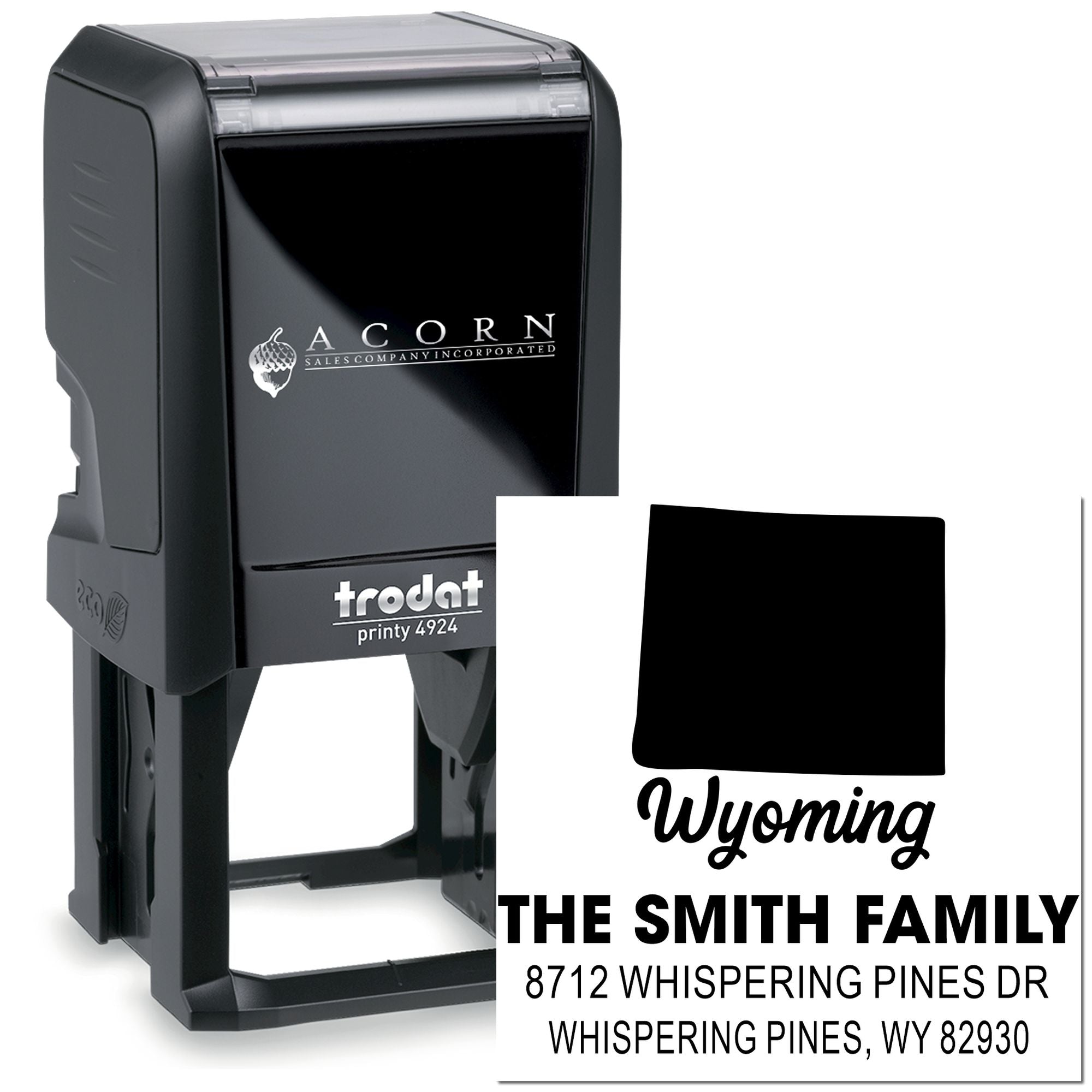 Black custom self-inking address stamp with Wyoming design and The Smith Family address imprint on a white background.