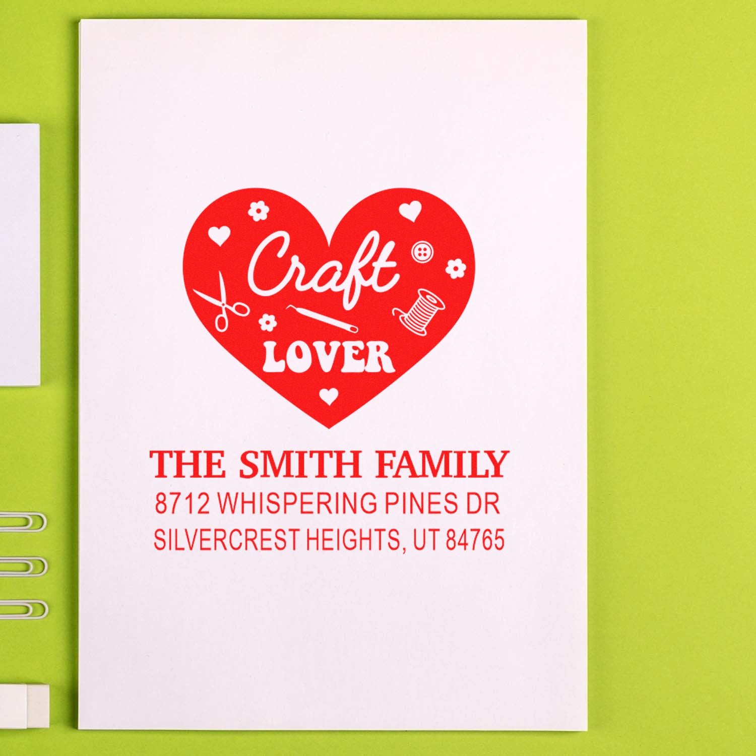 Custom address stamp with red heart Craft Lover design, The Smith Family name and Utah address on white card against lime green background.