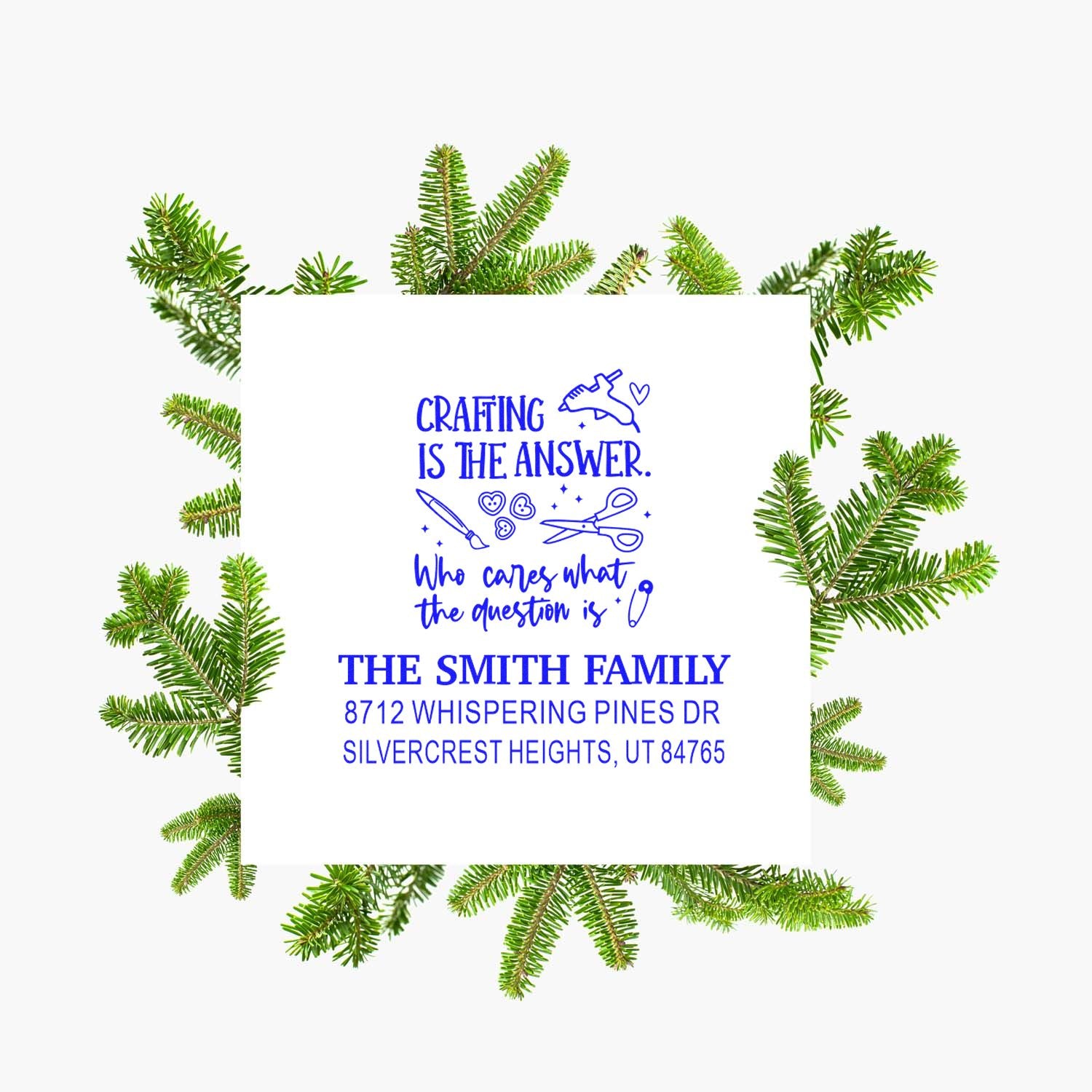 Custom return address stamp with Crafting is the answer quote, blue text, and Smith family address, framed by pine branches on a white background.