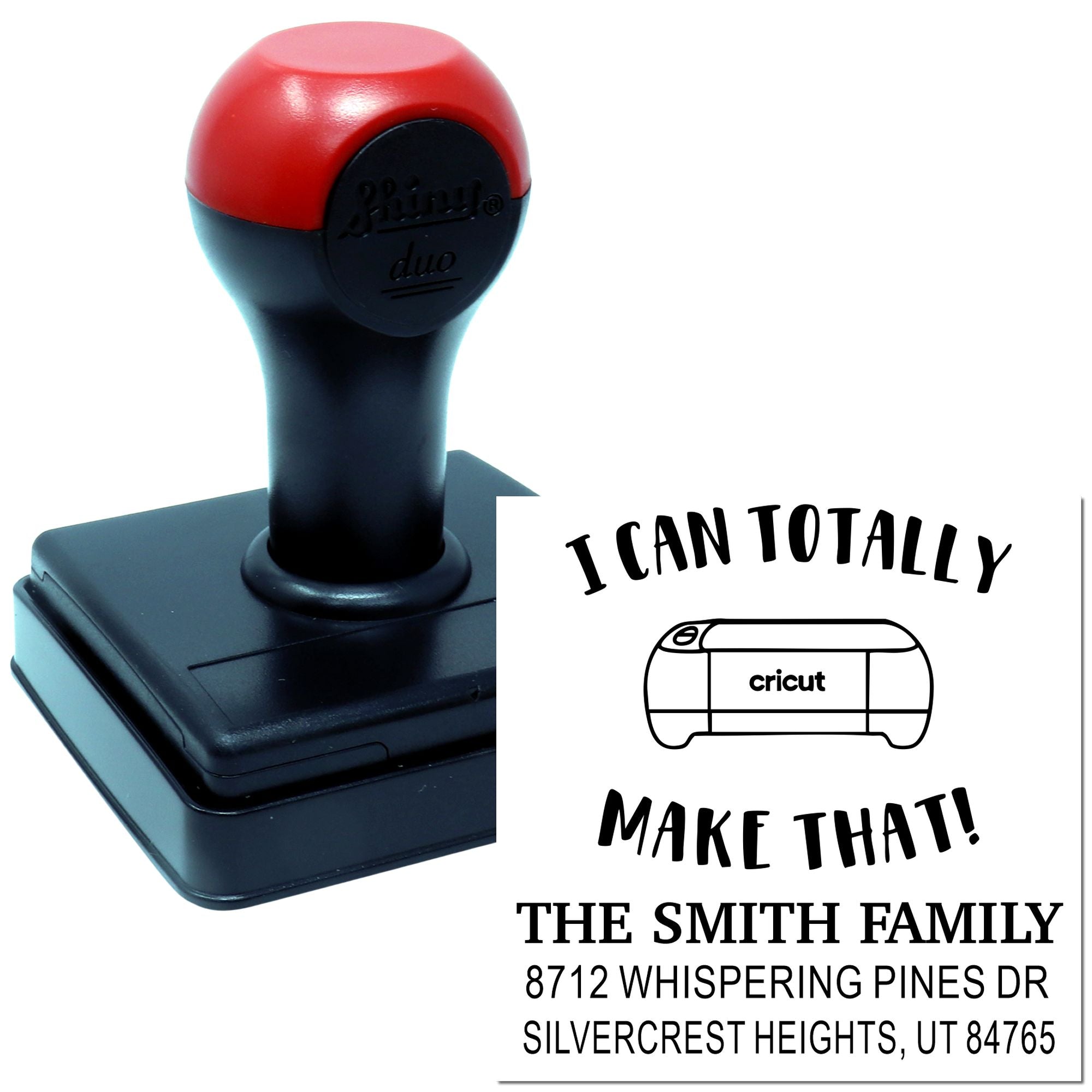 Custom self-inking return address stamp with red-and-black handle, showing a personalized family name and Cricut design on a white product display.