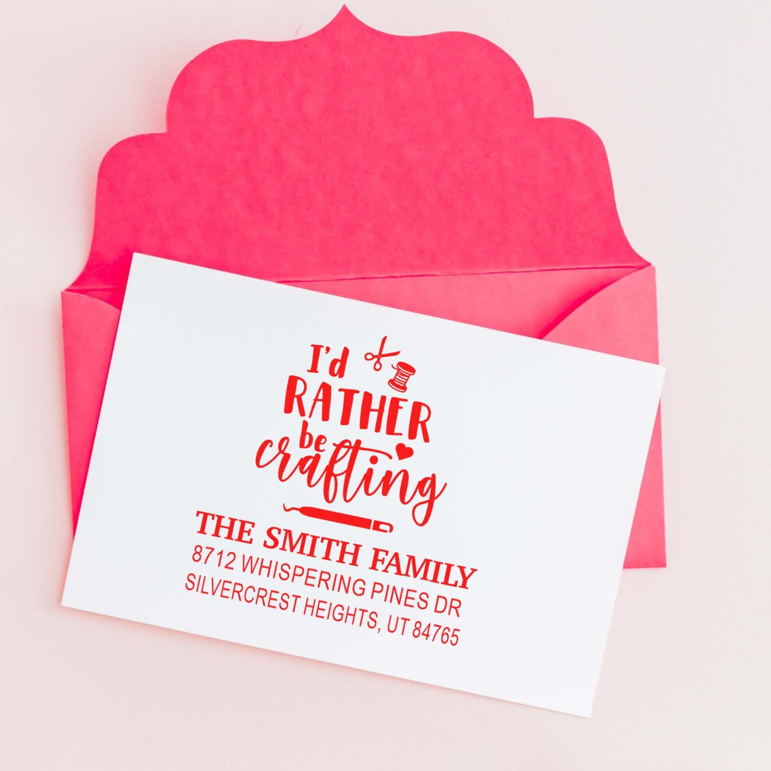 Custom red crafting return address stamp on a white card with a pink envelope, featuring Id rather be crafting for the Smith family.