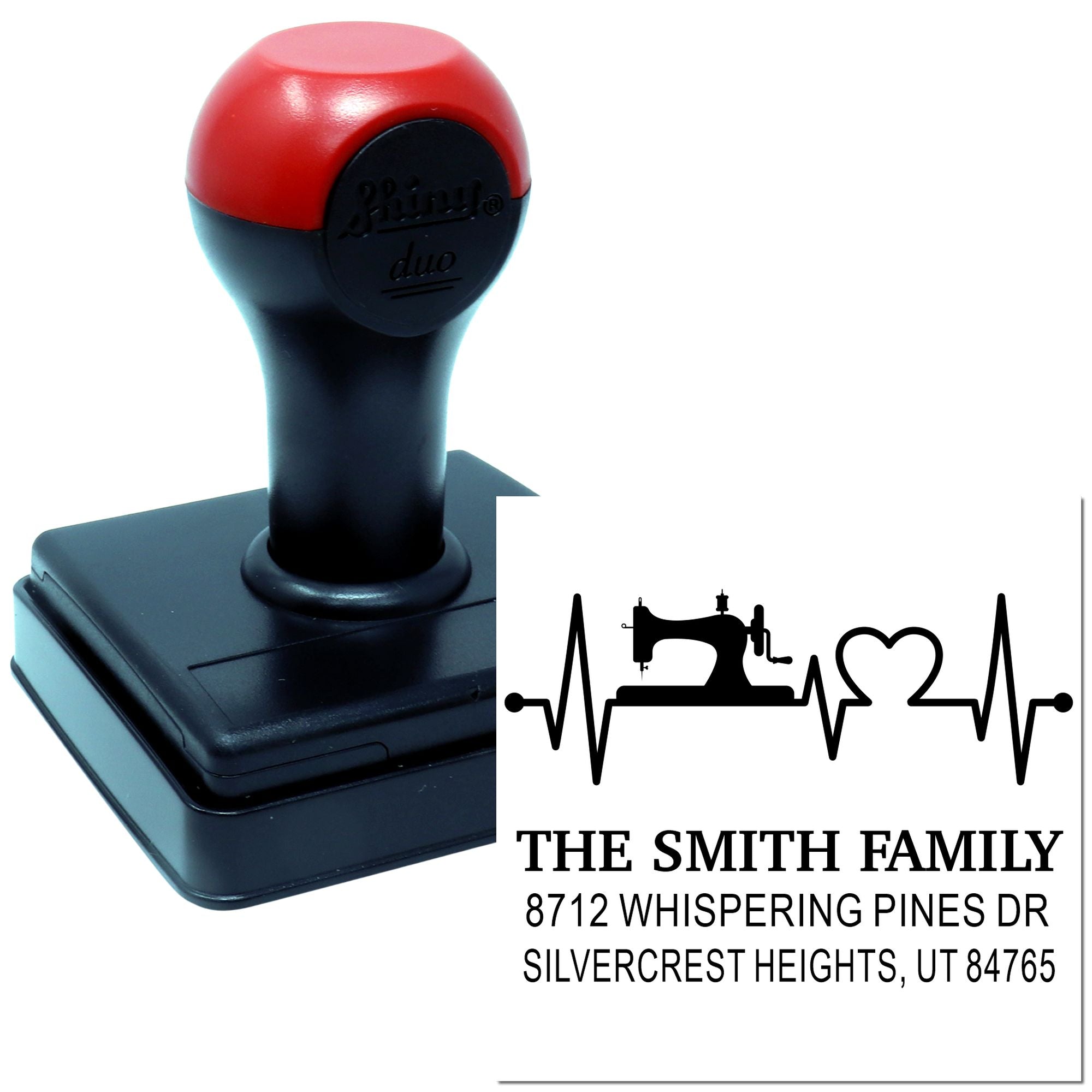 Custom self-inking address stamp with sewing machine heart design, showing The Smith Family address on a white background.