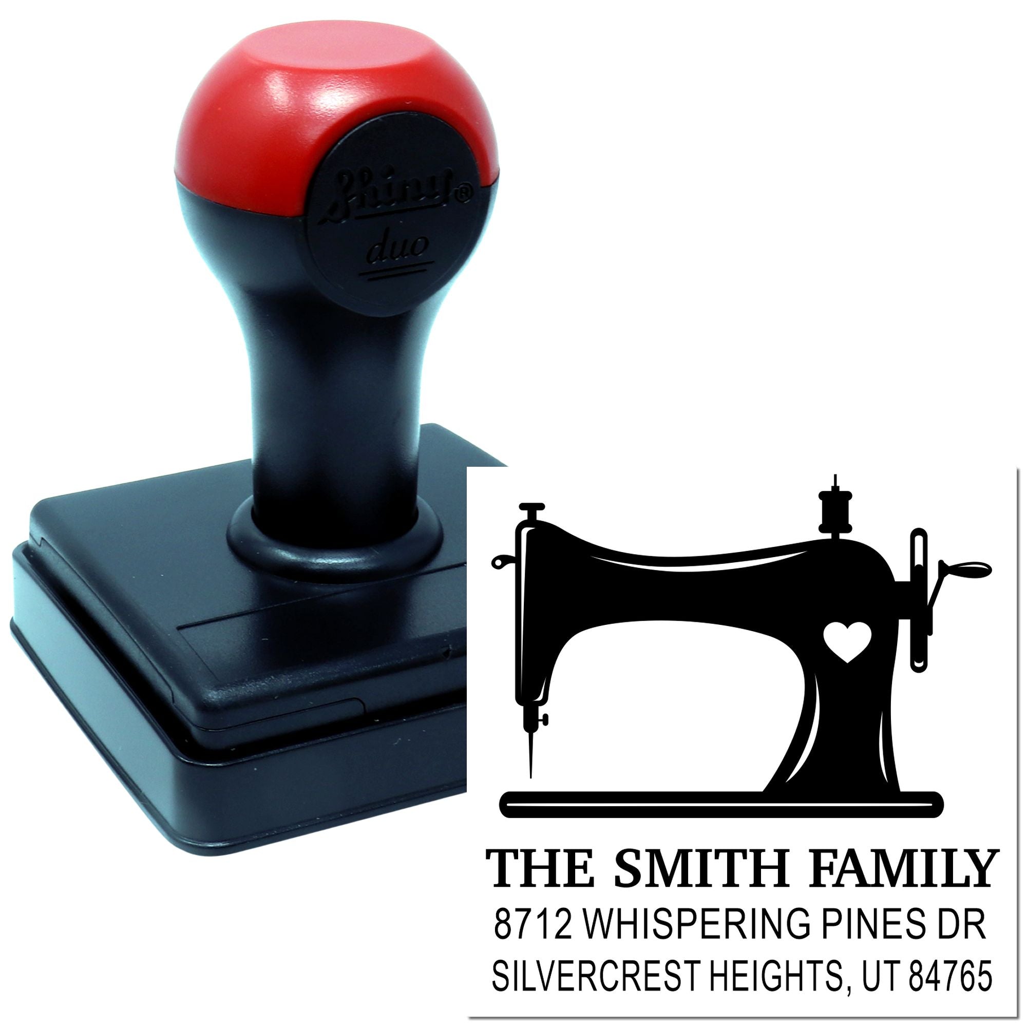 Custom self-inking stamp with sewing machine design and family address print preview, featuring a black-and-red handle on a white background.