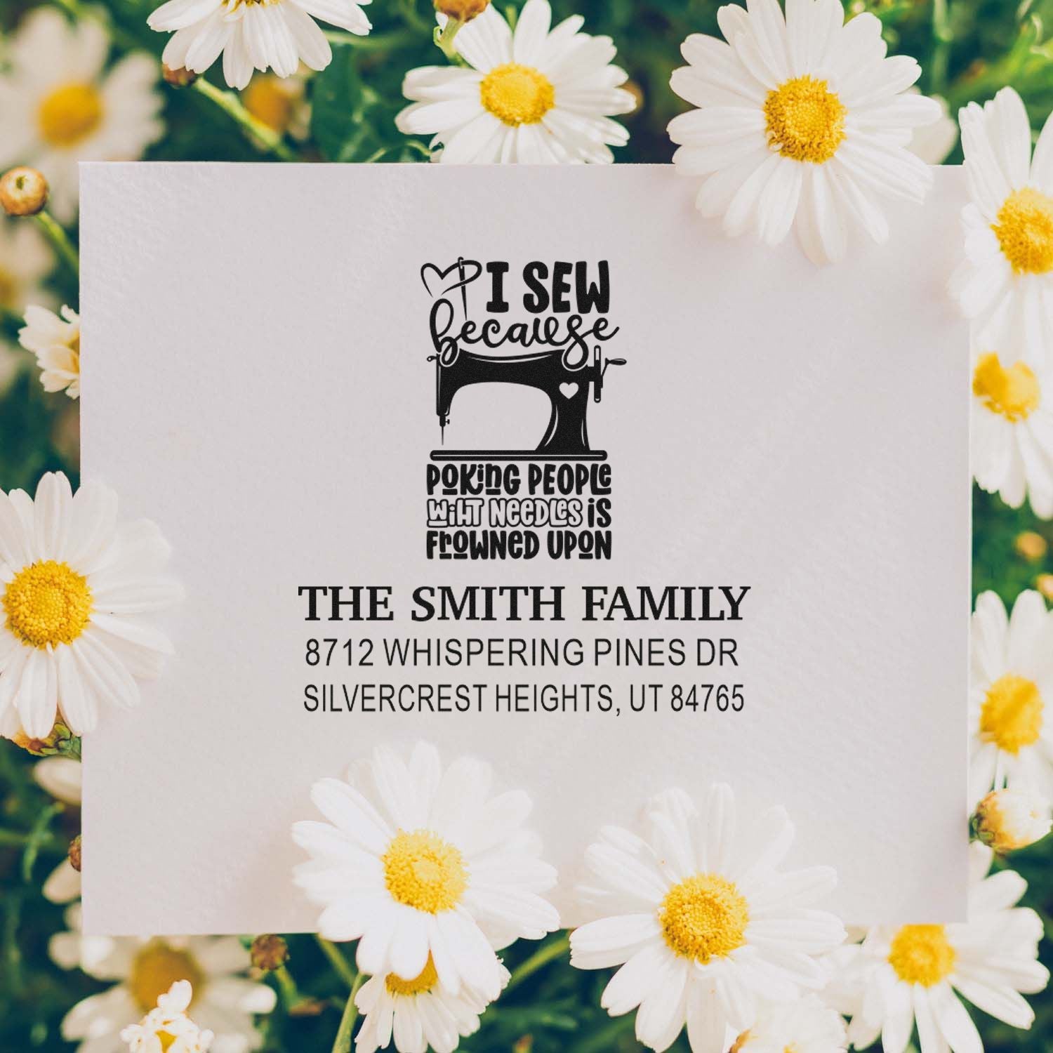 Custom address stamp for The Smith Family featuring a sewing machine quote, set on a daisy floral background.