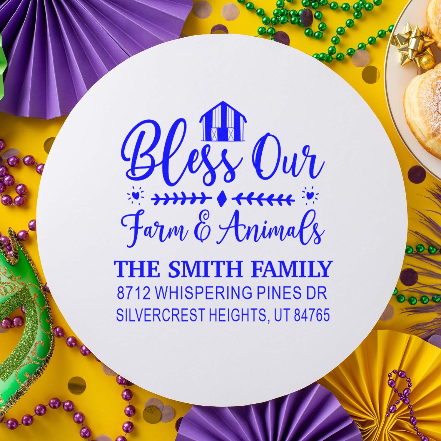 Custom round farm address stamp reading Bless Our Farm & Animals for The Smith Family, styled on Mardi Gras beads, masks and festive decor.