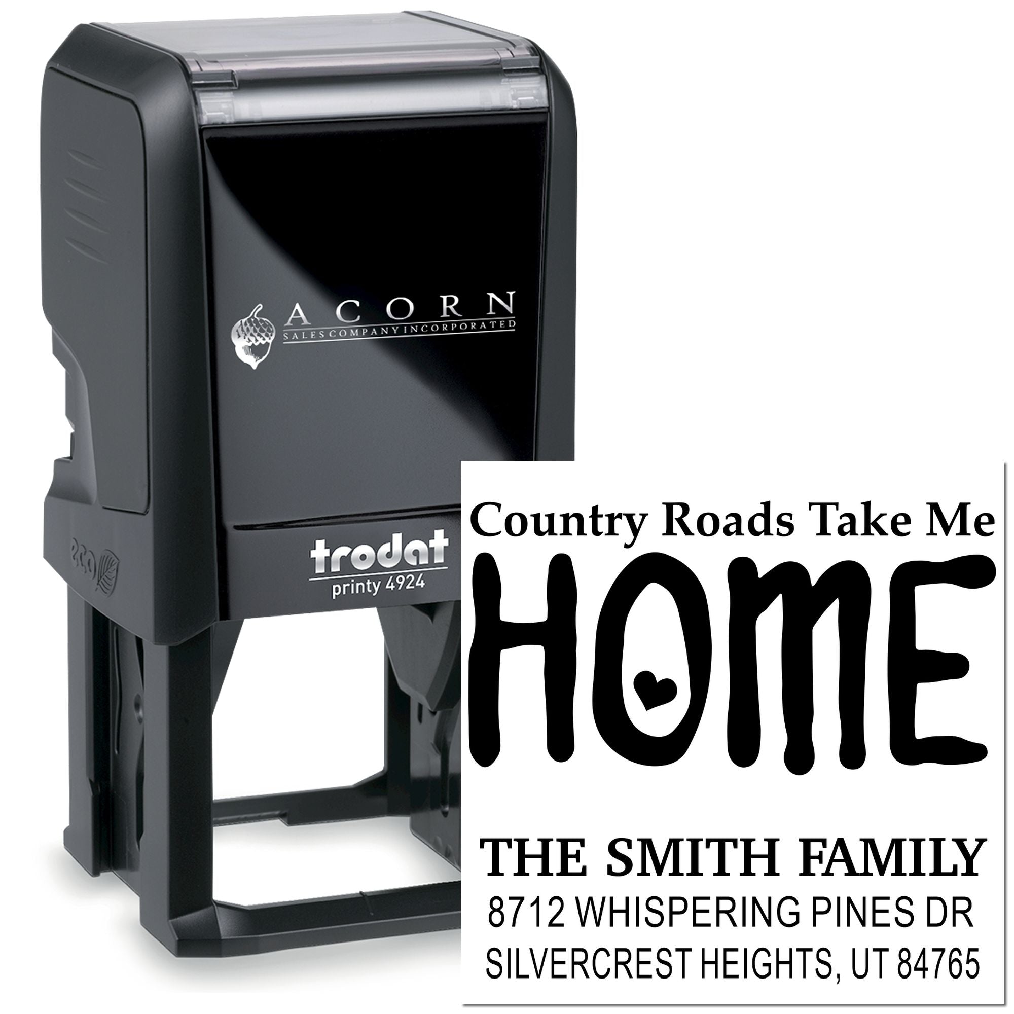 Custom address stamp by Trodat displaying HOME, family name, and address on a white background with black Acorn Sales Company case.
