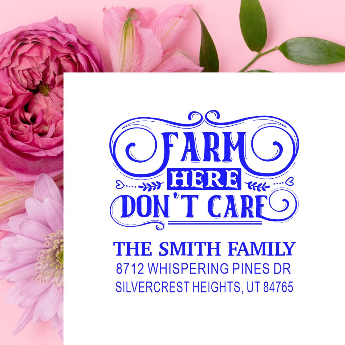 Custom blue farmhouse return address stamp reading Farm Here Dont Care for The Smith Family, displayed on a white card with pink floral background.