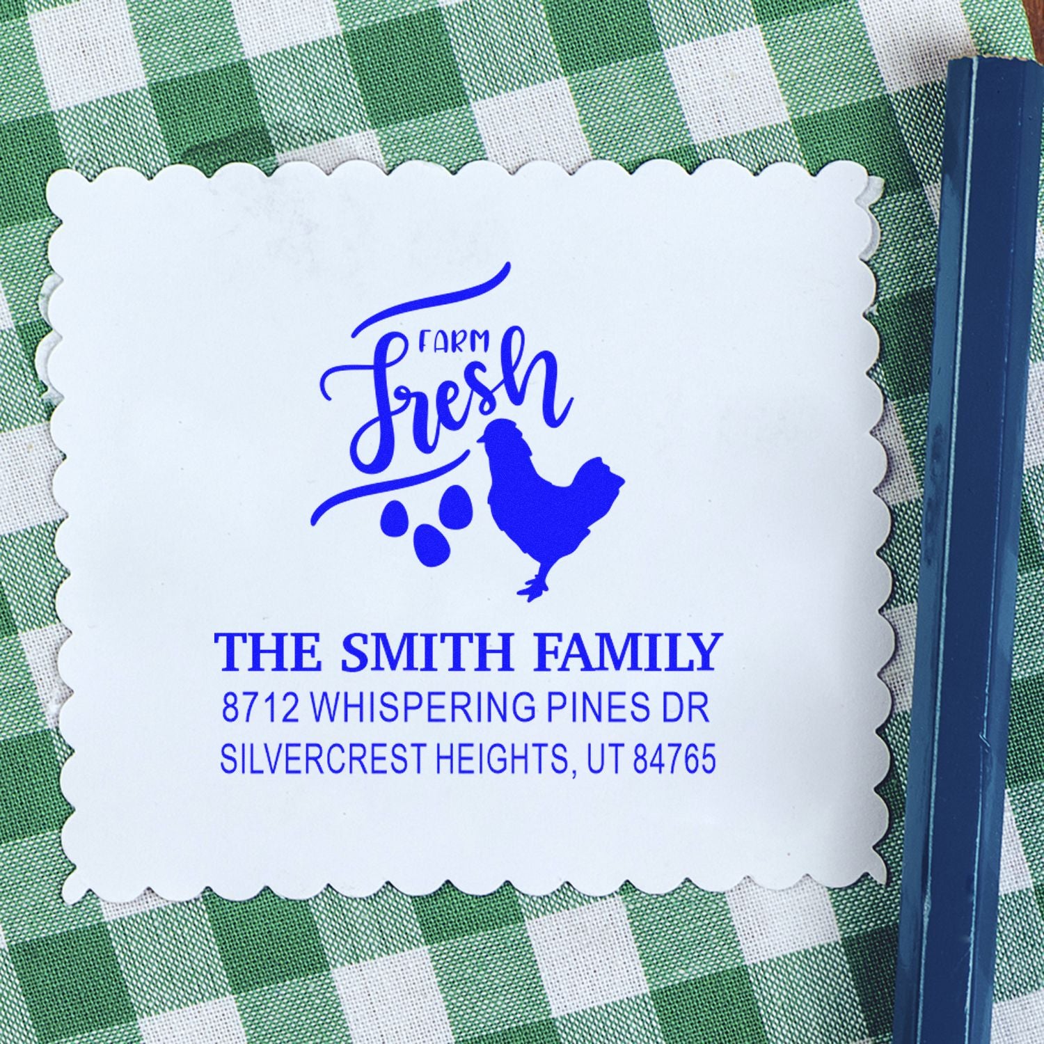 Custom Farm Fresh address stamp with chicken and eggs, showing The Smith Family details on a scalloped white stamp over green gingham, blue handle.