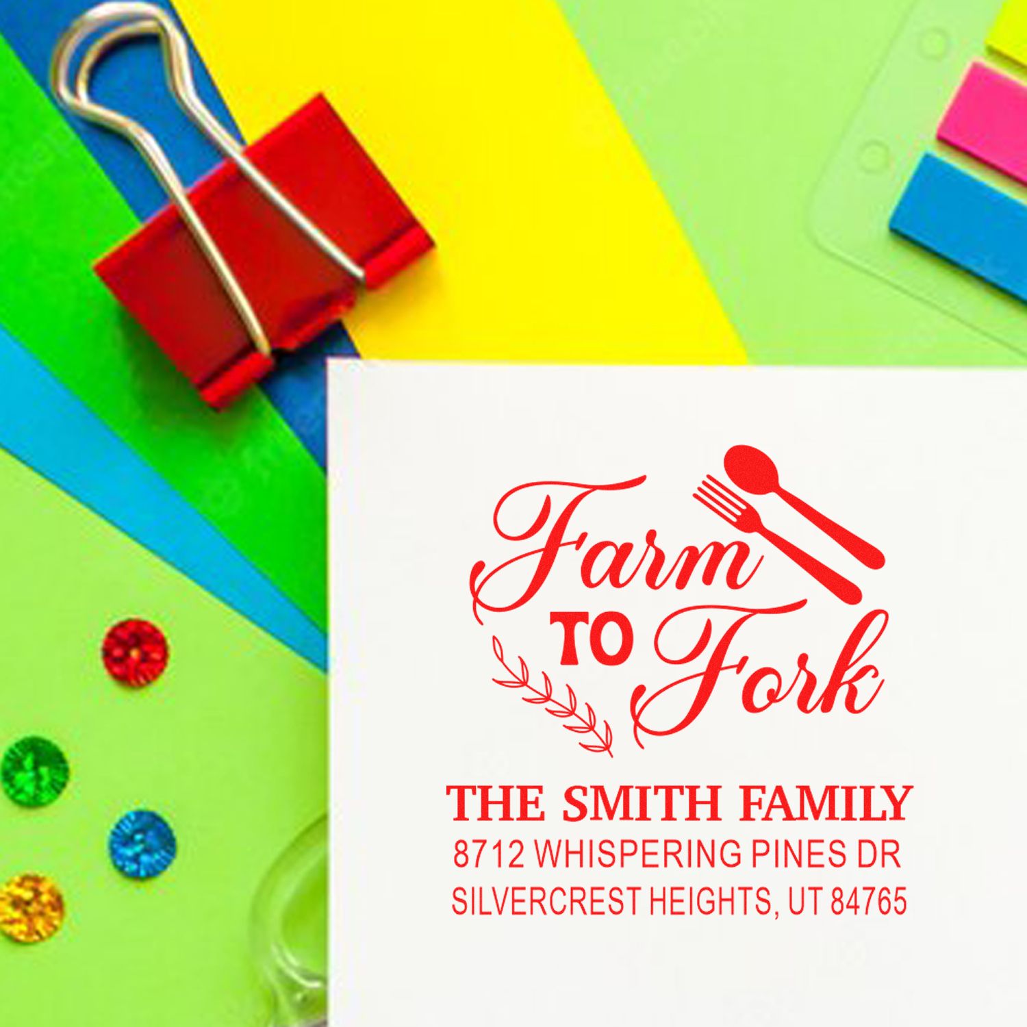 Custom Farm to Fork return address stamp with spoon and fork design, displayed on colorful stationery with binder clip and sticky notes.