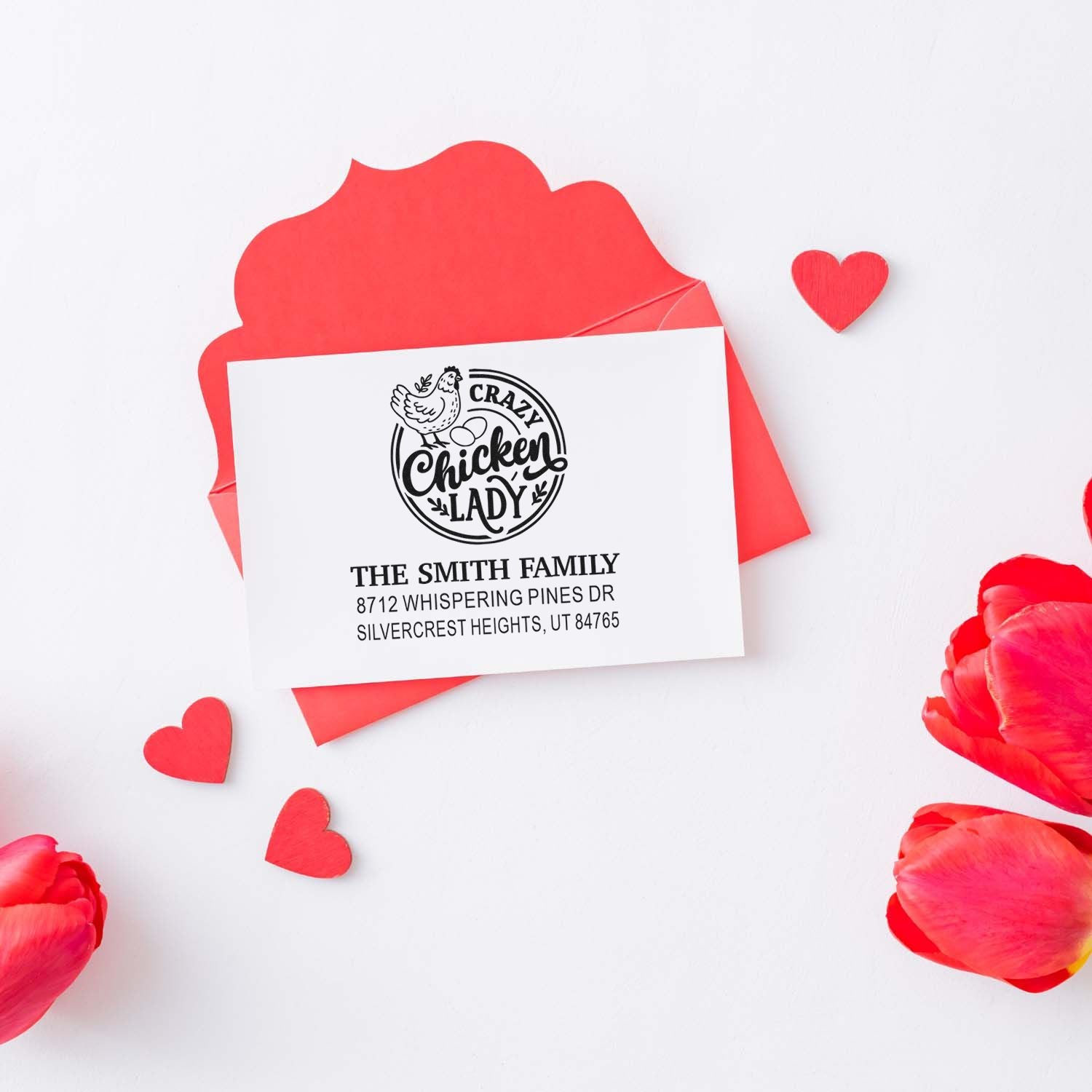 Personalized return address stamp with Crazy Chicken Lady design on white card, surrounded by red envelope, hearts, and pink petals.