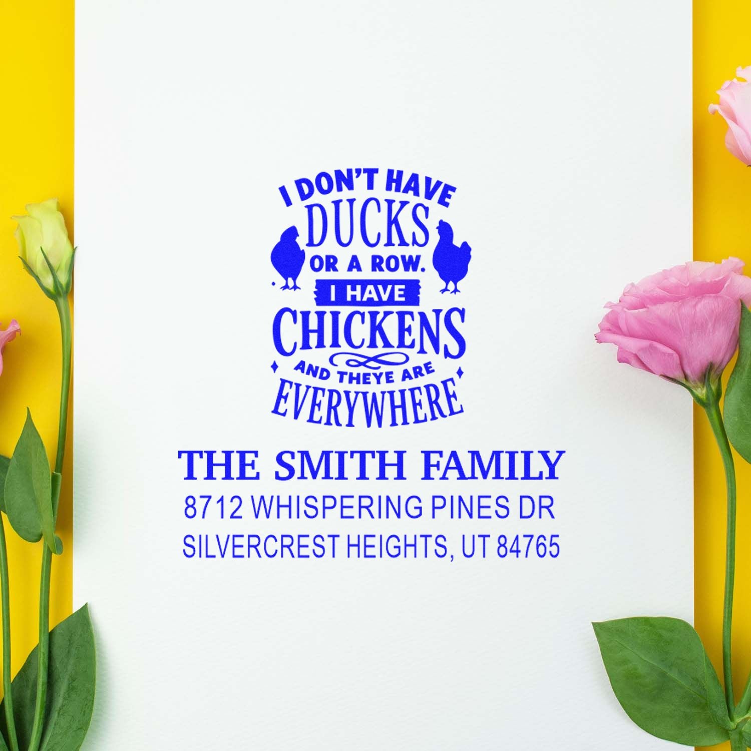 Custom address stamp with humorous blue farmyard text on white paper, framed by pink and yellow flowers.