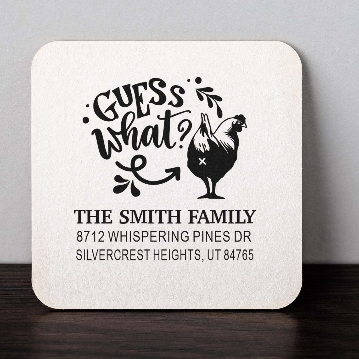 Custom address stamp with Guess what? rooster design for The Smith Family, featuring house address on a white square stamp block.