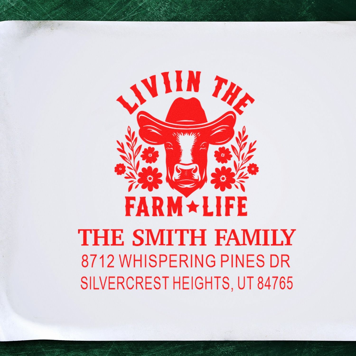 Custom red farm life address stamp with cow and floral design for The Smith Family on white paper, featuring Whispering Pines Dr, Silvercrest Heights, UT.