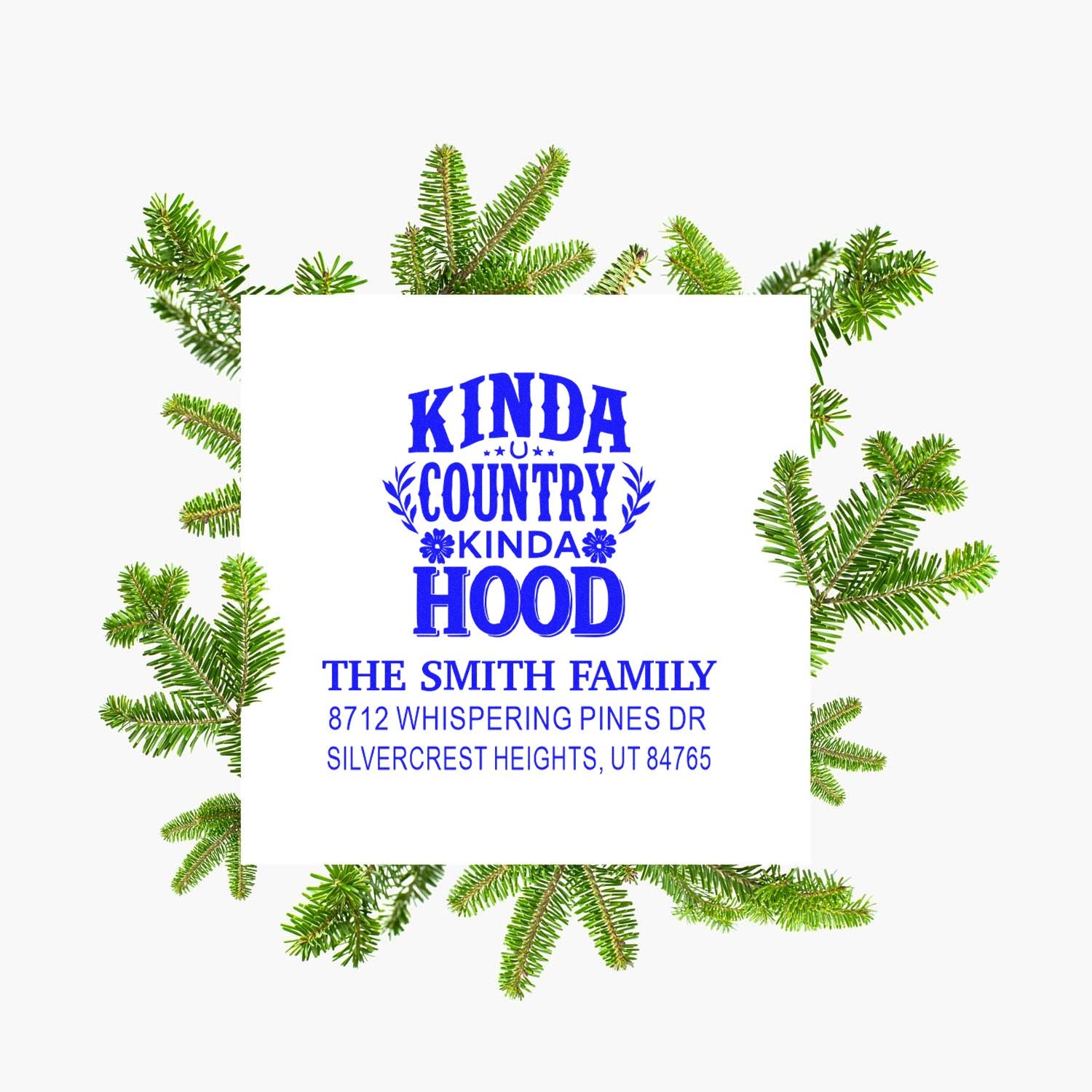 Custom return address stamp with blue Kinda Country Kinda Hood text, The Smith Family address, framed by evergreen pine branches.