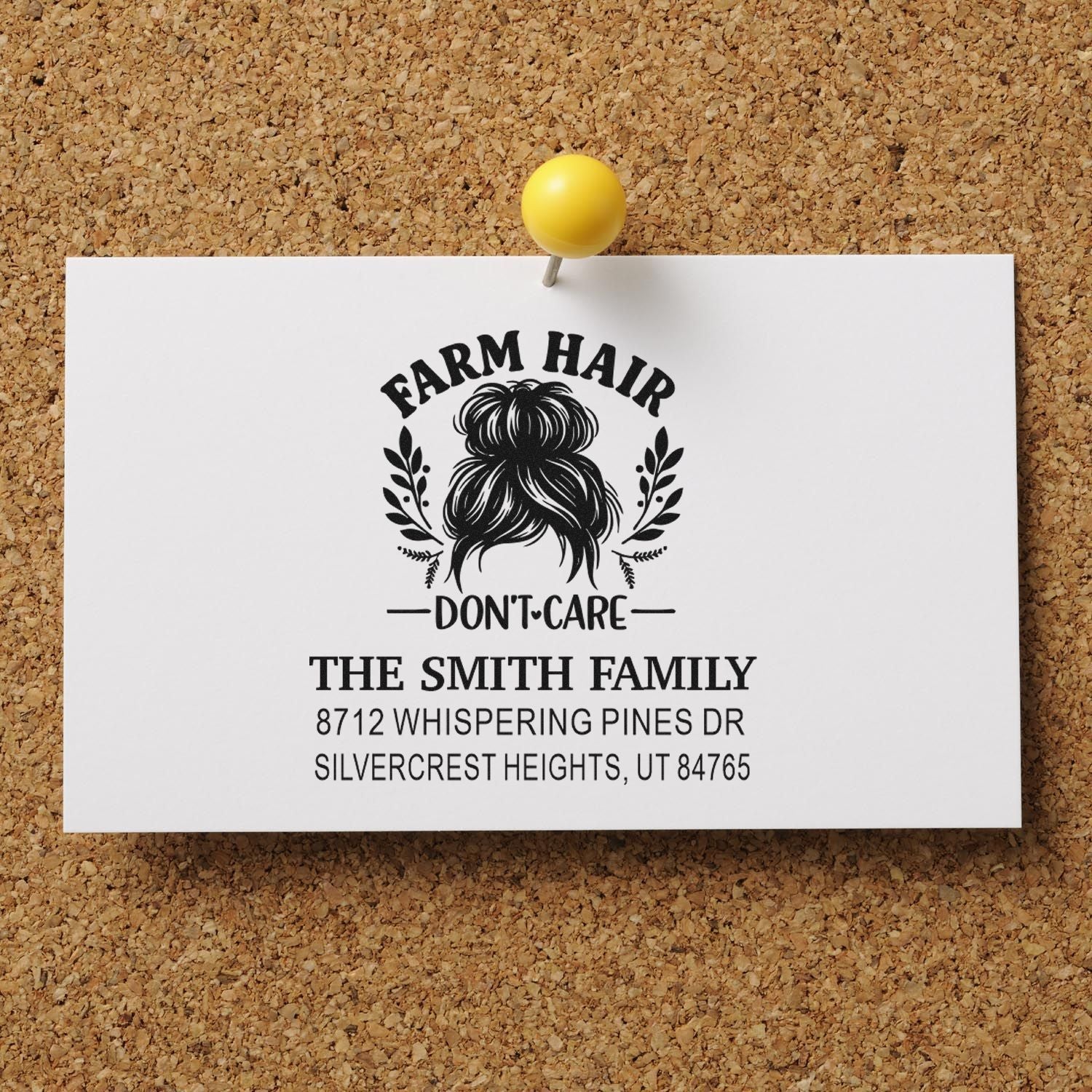 Personalized farmhouse hair dont care return address stamp for The Smith Family, pinned on a corkboard with yellow pushpin.