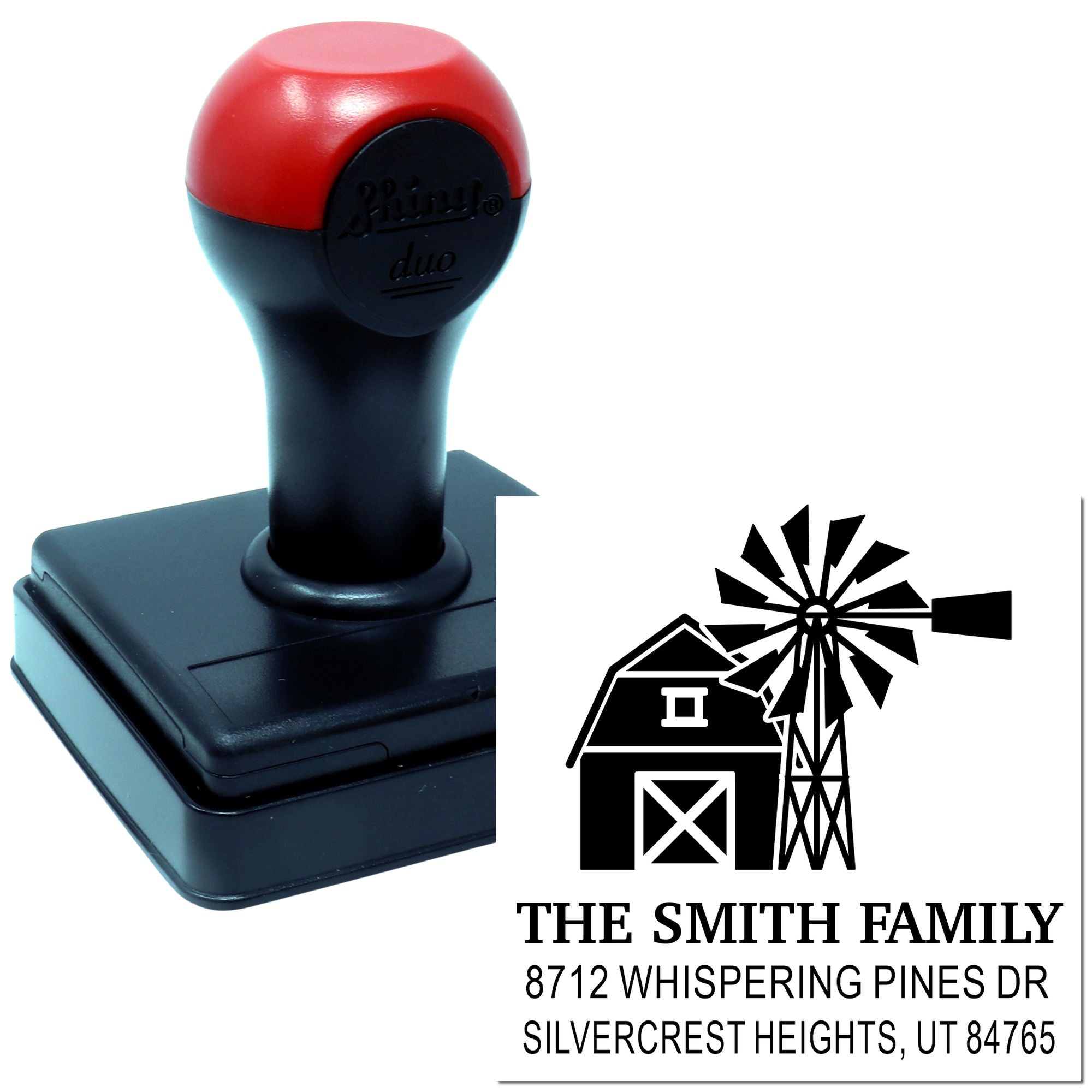 Custom self-inking address stamp with barn and windmill design, shown beside its return address imprint for The Smith Family on a white background.