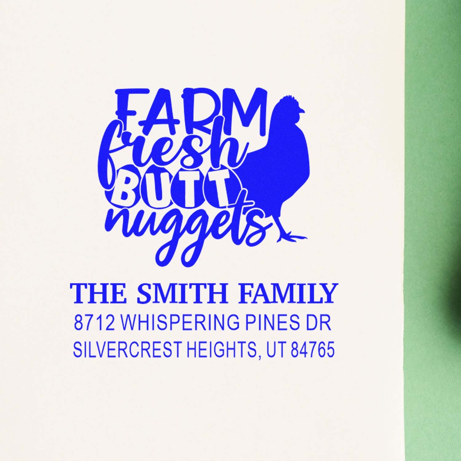 Blue custom return address stamp with Farm Fresh Butt Nuggets text and chicken silhouette for The Smith Family on white paper.