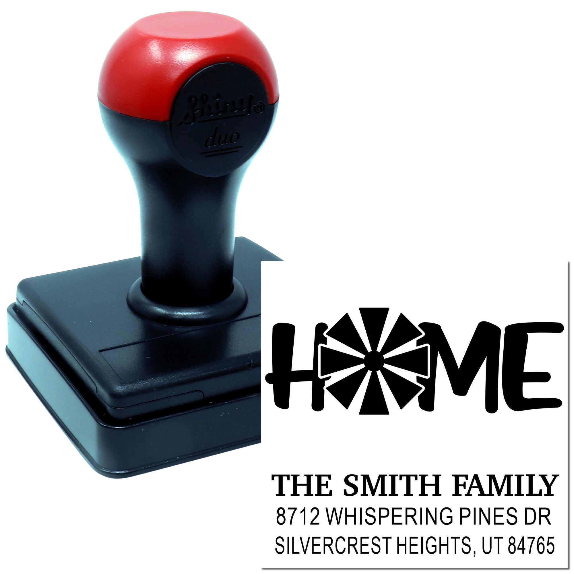 Custom self-inking home address stamp with red and black handle, printing HOME, The Smith Family, and Silvercrest Heights, UT on a white background.