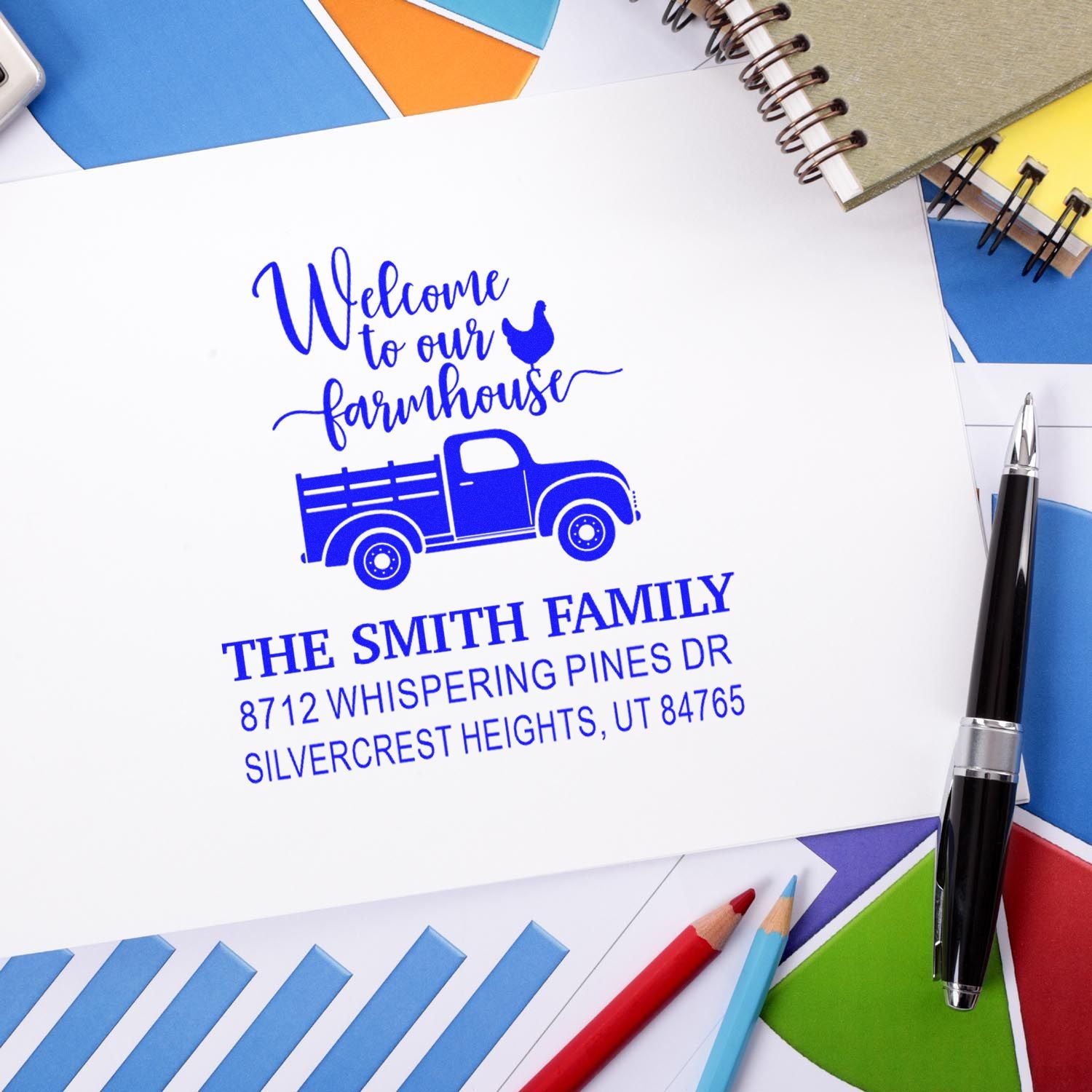 Custom farmhouse return address stamp for The Smith Family, featuring a blue truck and chicken, on stationery with colorful envelopes and pens.