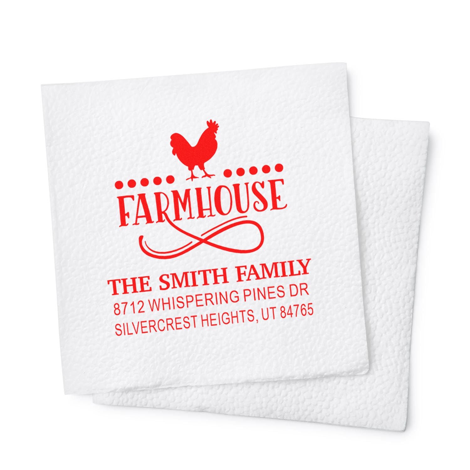 Red farmhouse return address stamp with rooster logo on white textured cards, personalized for The Smith Family, in a clean studio setting.