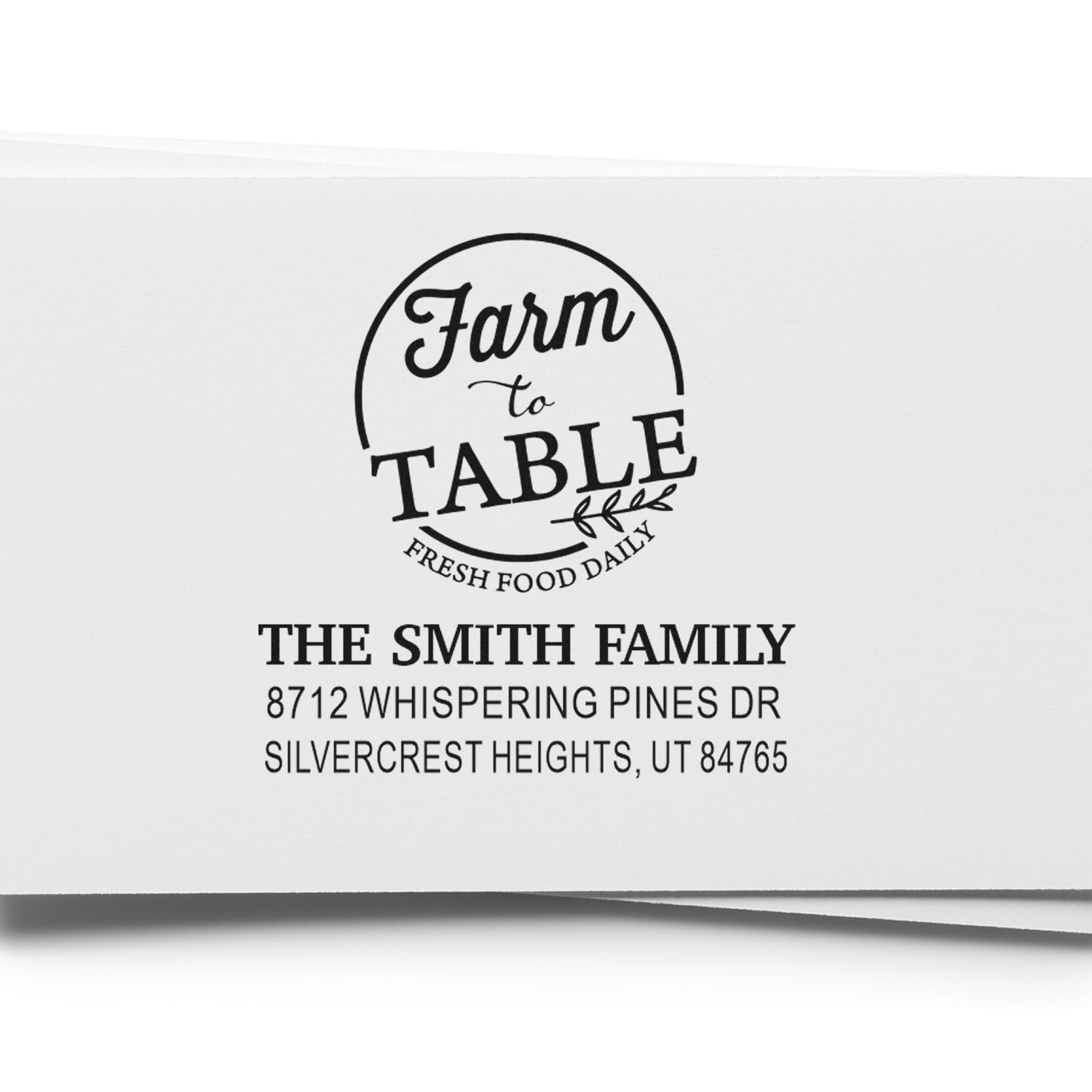 Custom farmhouse-style address stamp reading Farm to Table with The Smith Family name and Utah address on white paper.