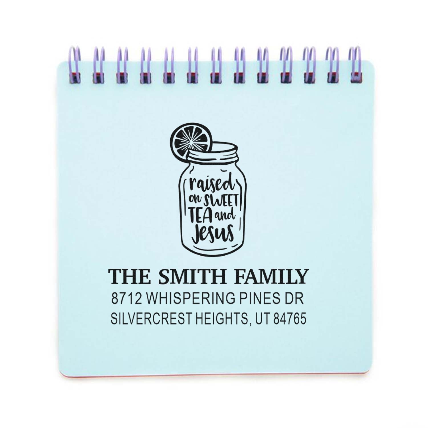 Custom return address stamp with mason jar quote Raised on sweet tea and Jesus for The Smith Family, featuring name and address on a blue notepad.