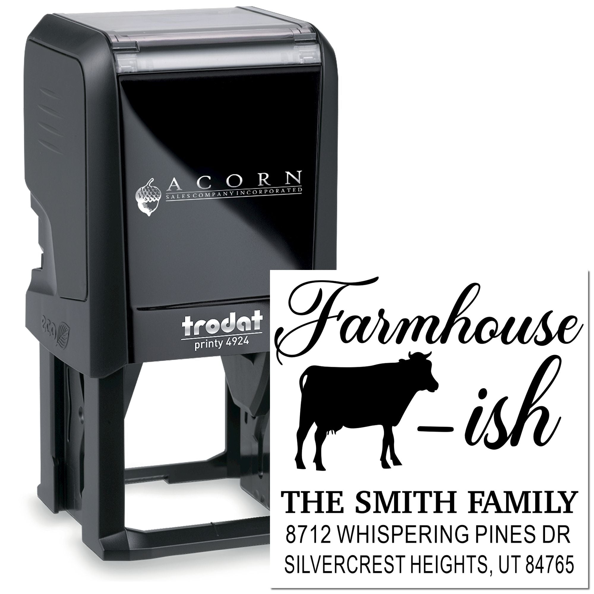 Custom self-inking farmhouse address stamp with cow silhouette and family name, showing black Trodat-style stamp and printed impression on white background.