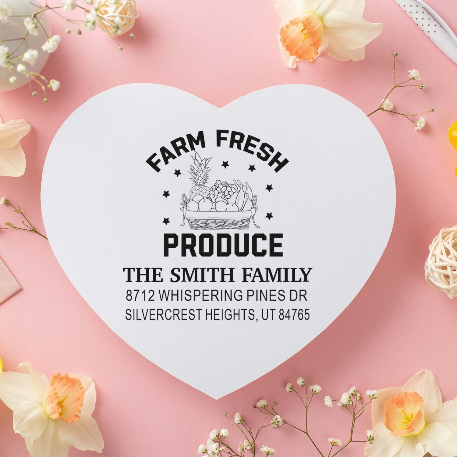 Heart-shaped custom produce stamp with Farm Fresh basket design on pink floral background, featuring The Smith Family name and address.
