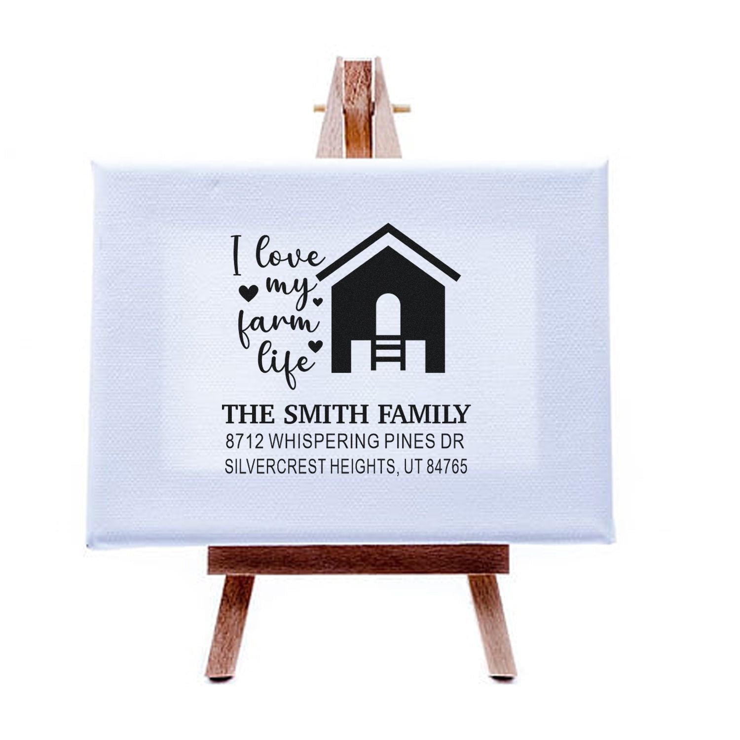 Personalized farmhouse return address stamp with I love my farm life barn graphic, displayed on a small wooden easel.