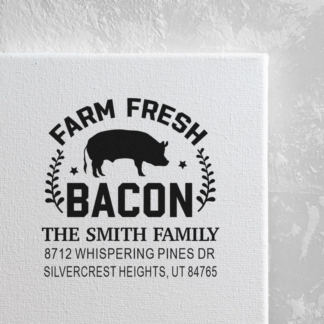 Custom farm fresh bacon return address stamp with pig silhouette, Smith family name, and address on a white textured background.