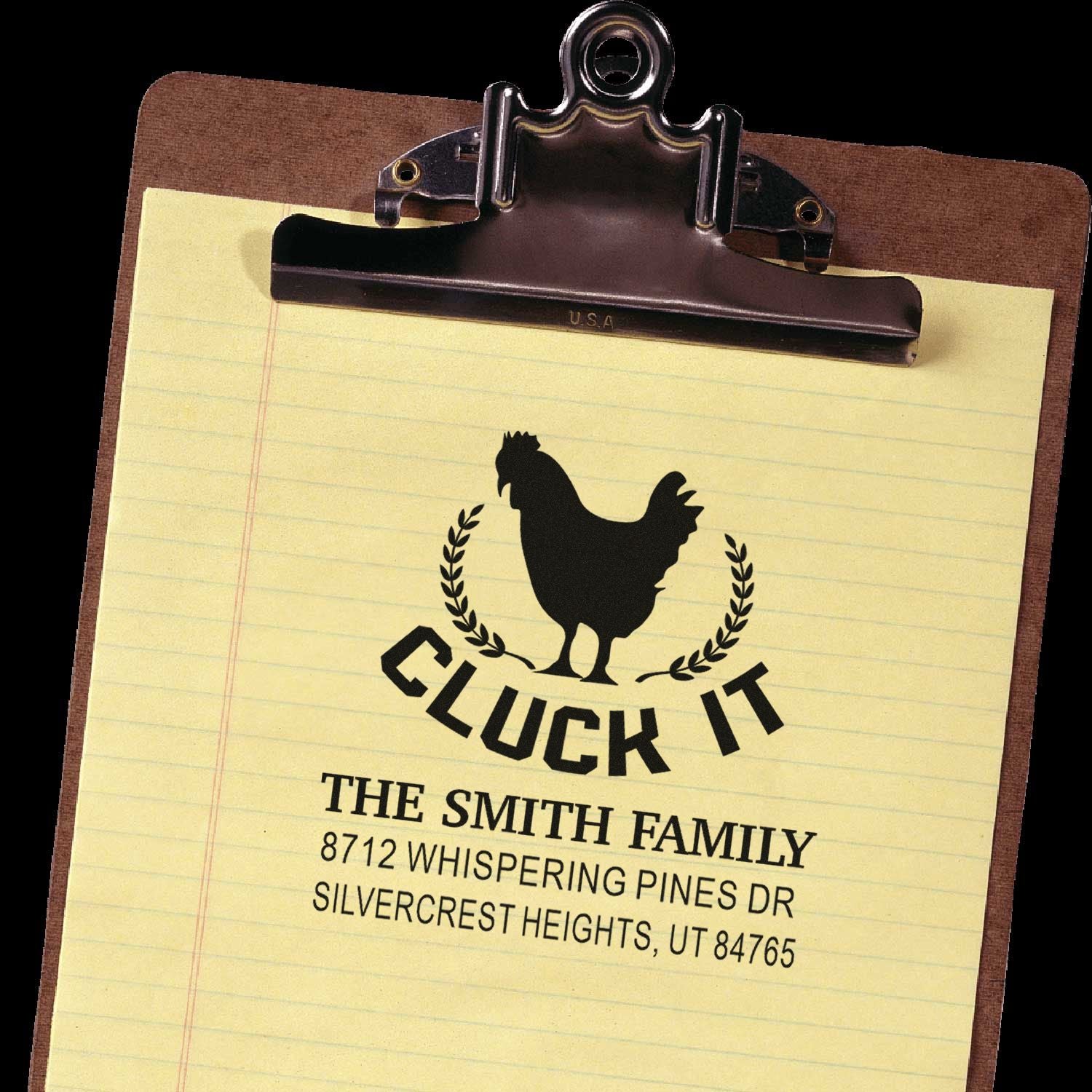 Custom Cluck It family address stamp on clipboard paper, featuring a chicken silhouette and home address design.