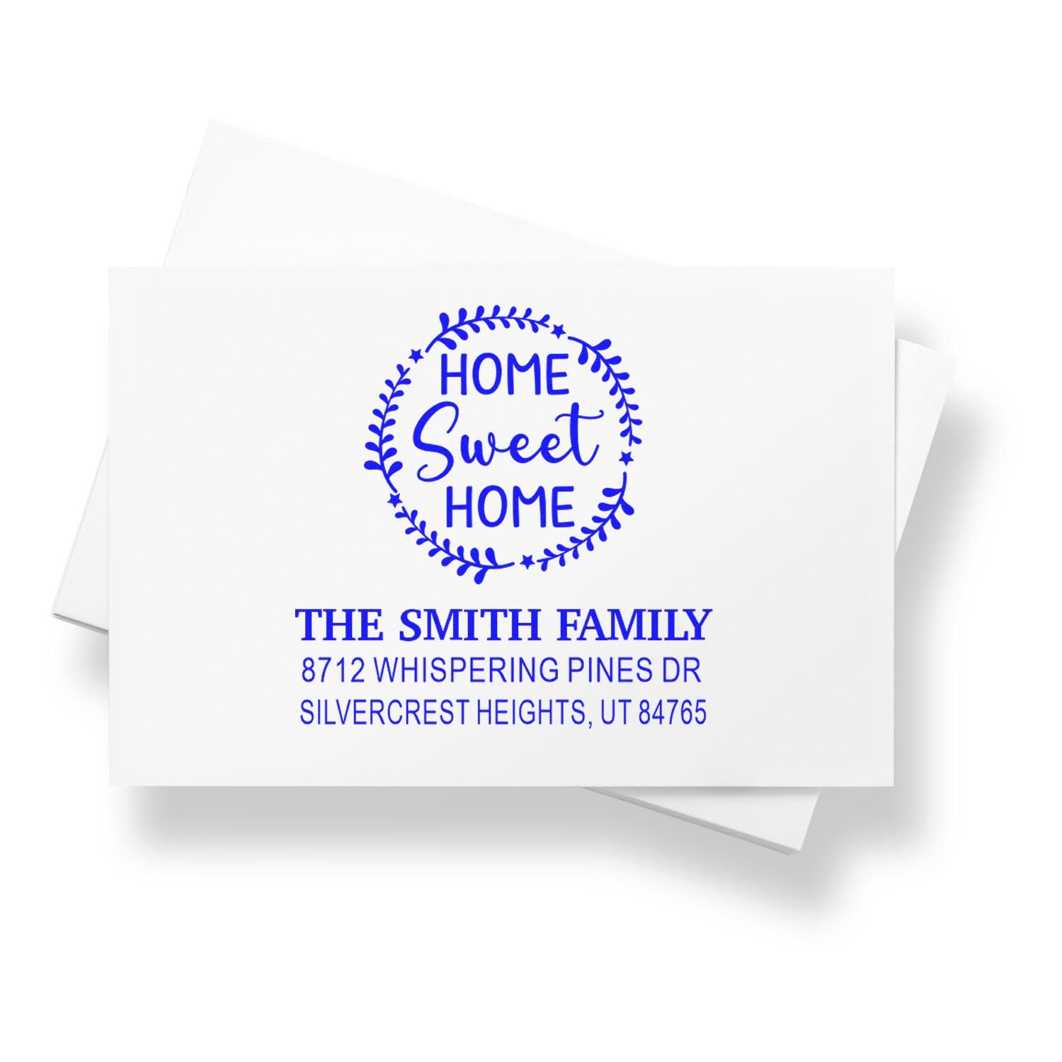 Custom blue Home Sweet Home return address stamp for The Smith Family on white stationery with address details