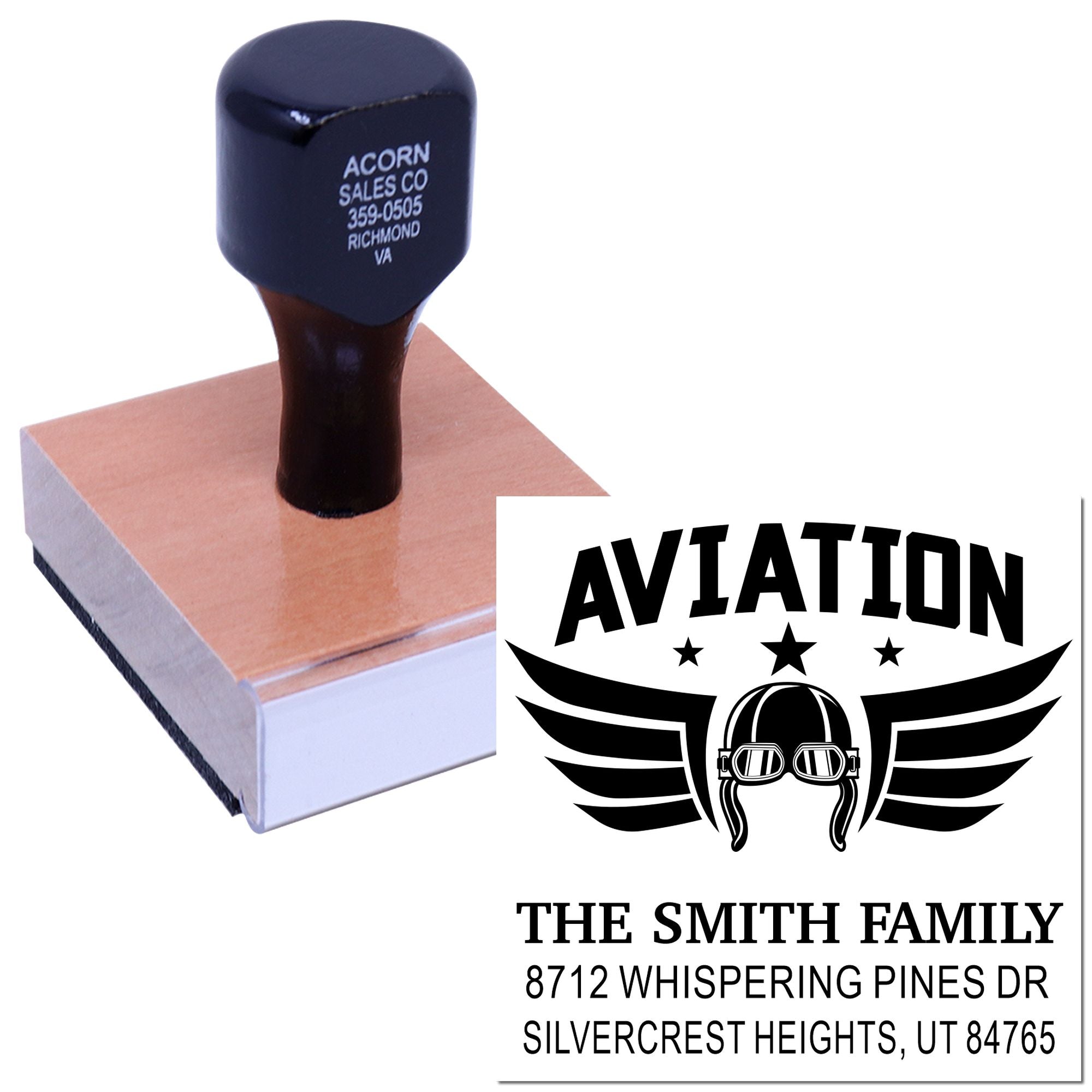 Custom return-address stamp with aviation logo, showing a self-inking rubber stamp on a pad against a white background.