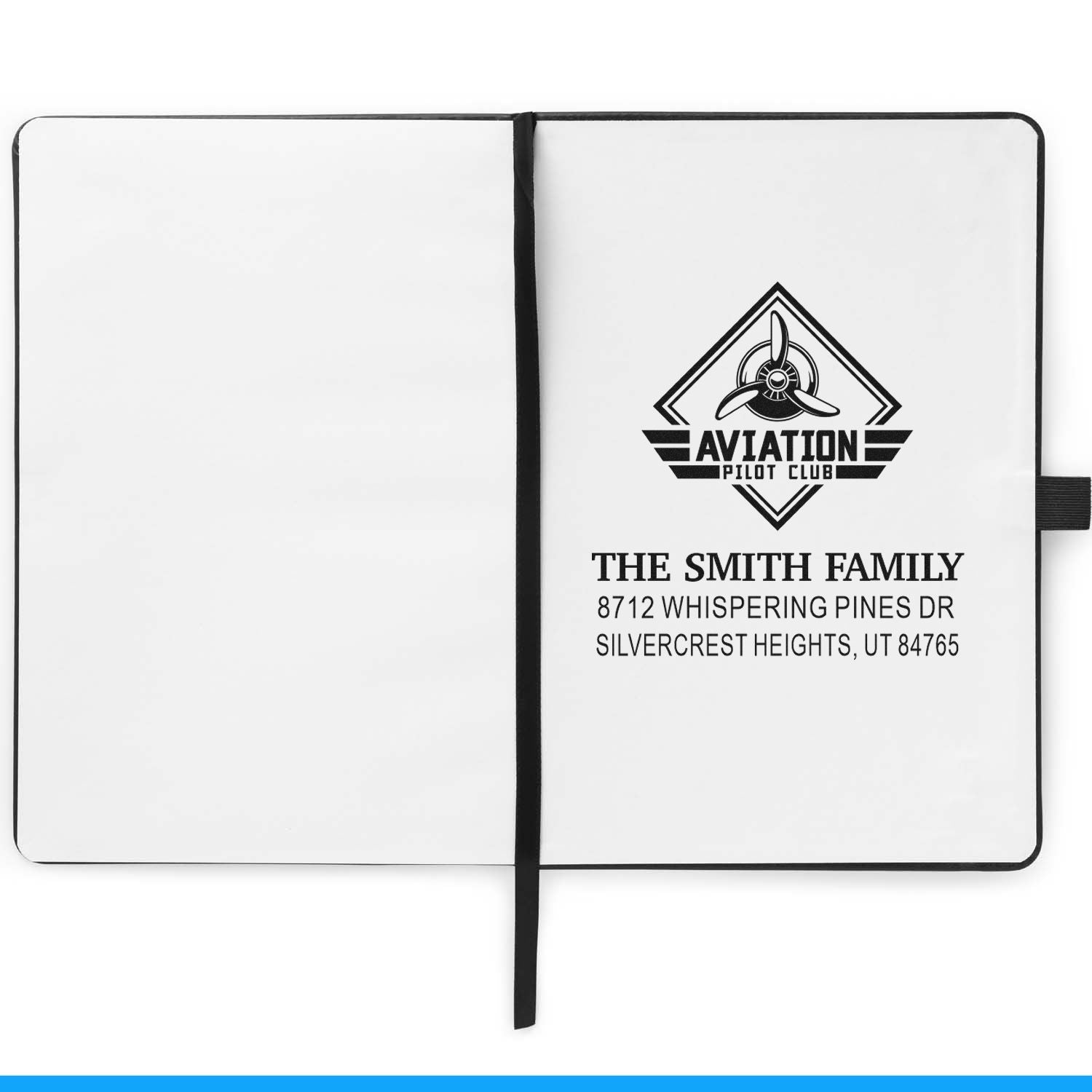 Custom aviation pilot club address stamp on open notebook, showing propeller logo, The Smith Family name, and return address.