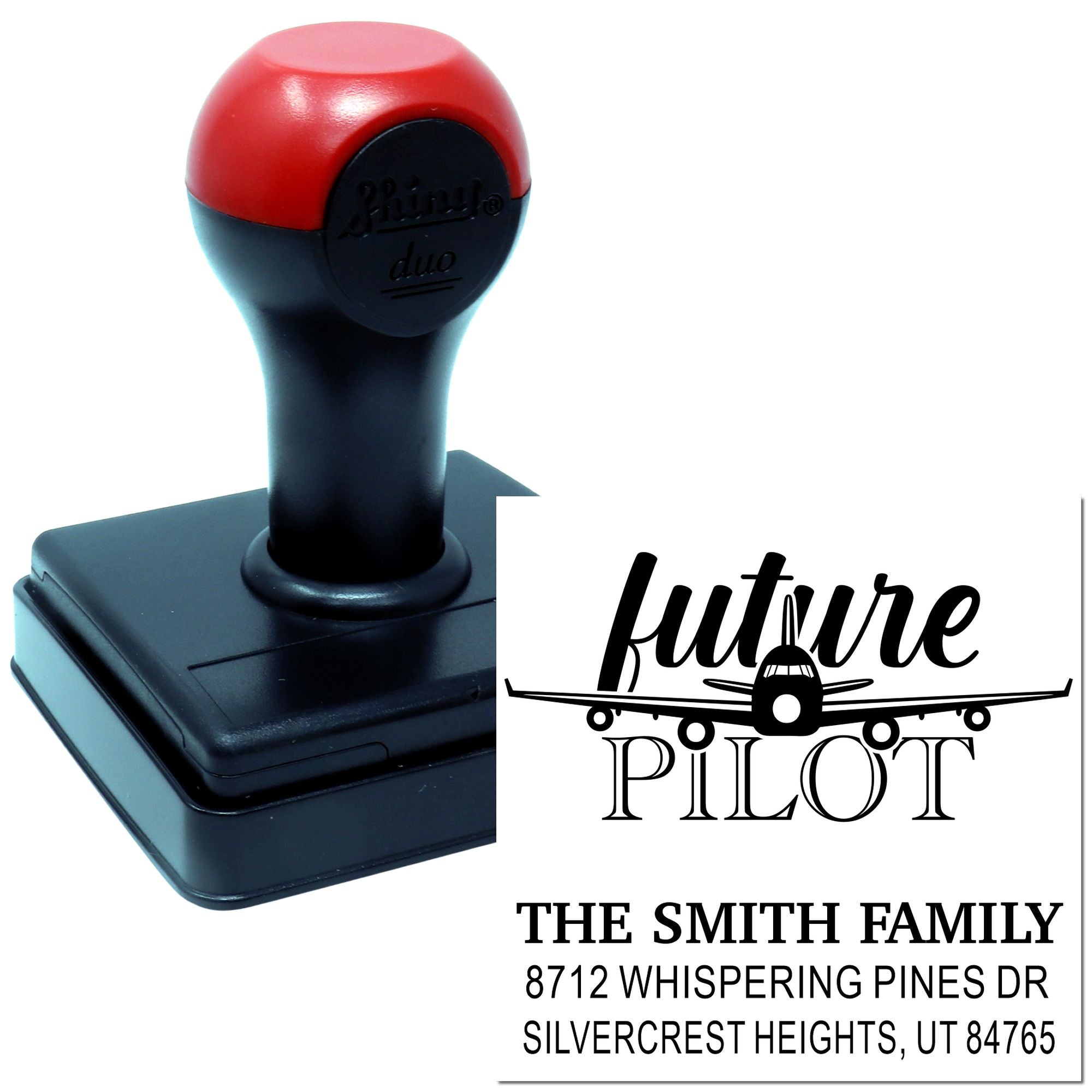 Custom self-inking address stamp with red-and-black handle, featuring future pilot airplane design and The Smith Family address on a white background.
